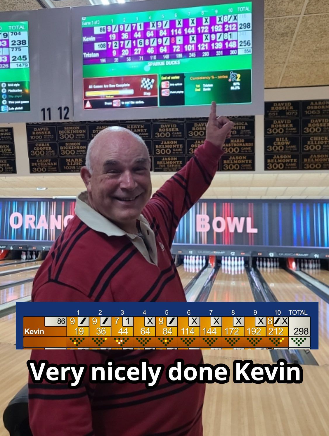 Smiling Man Points at Bowling Scoreboard at Orange Bowl — Orange Tenpin Bowl in Orange, NSW
