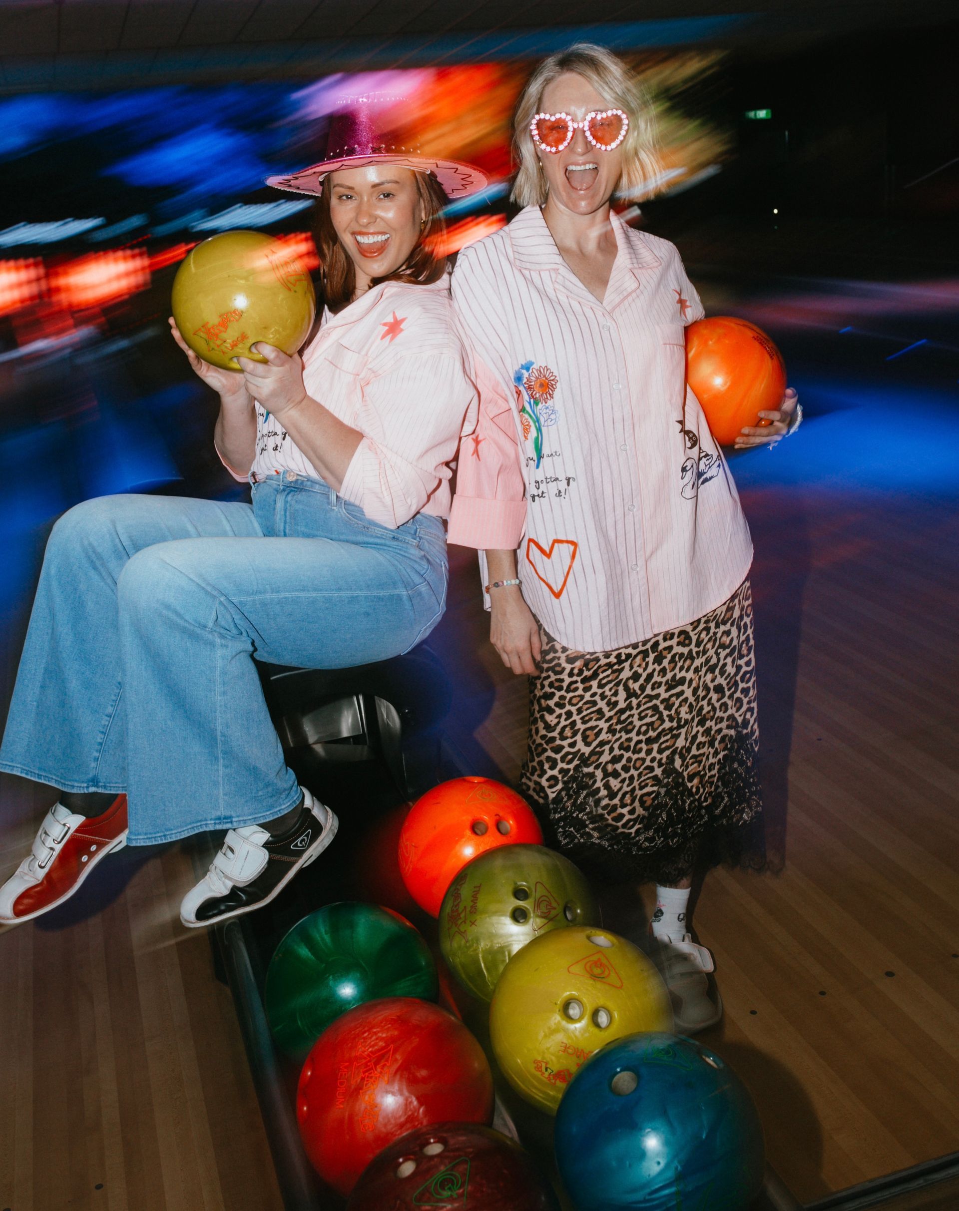 Two People at a Bowling Alley Holding Balls and Posing — Orange Tenpin Bowl in Orange, NSW