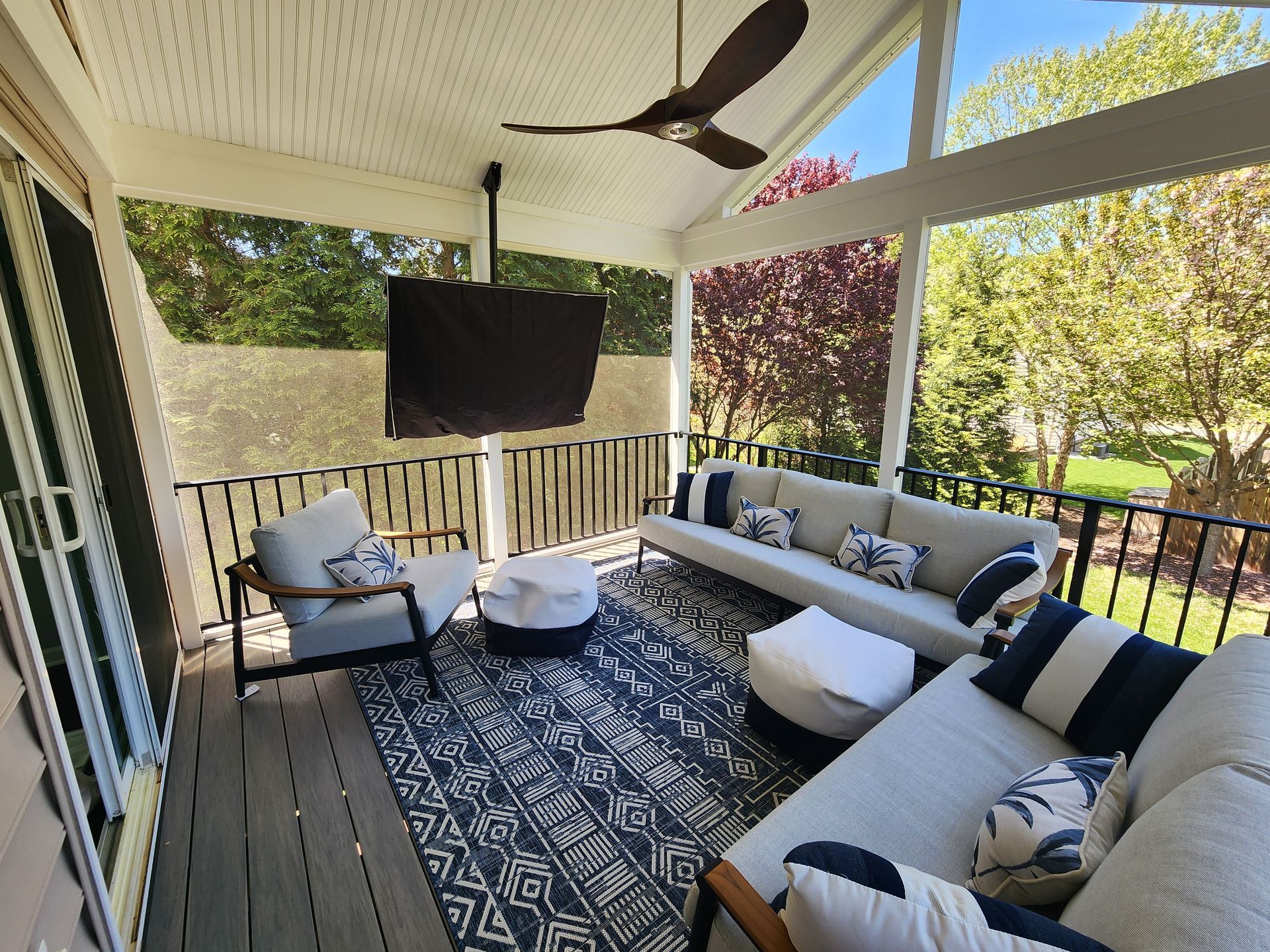 A wooden deck is being built on the side of a house.