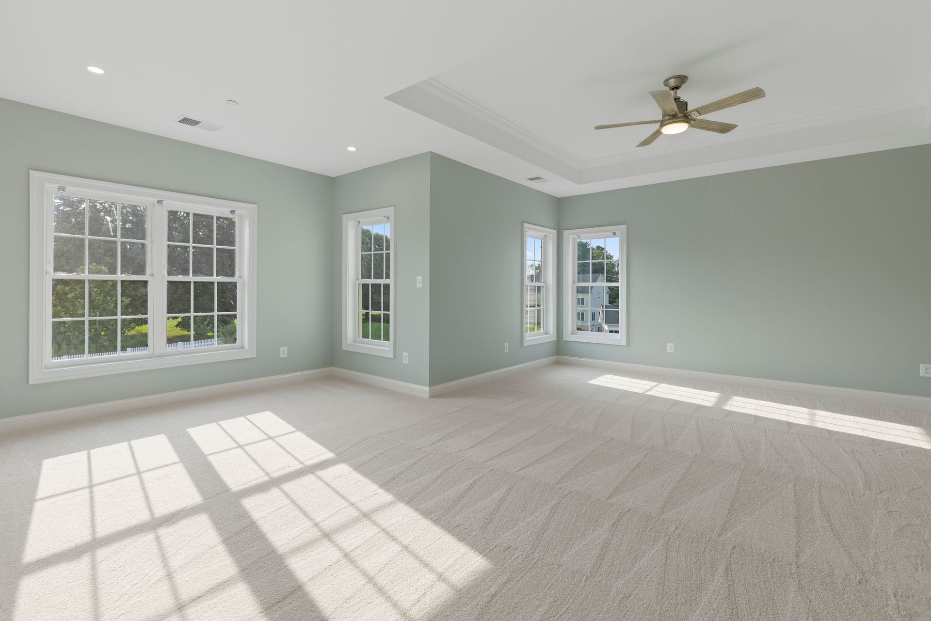 Master bedroom remodel ideas: custom tray ceiling and recessed lighting installation for luxury homes.