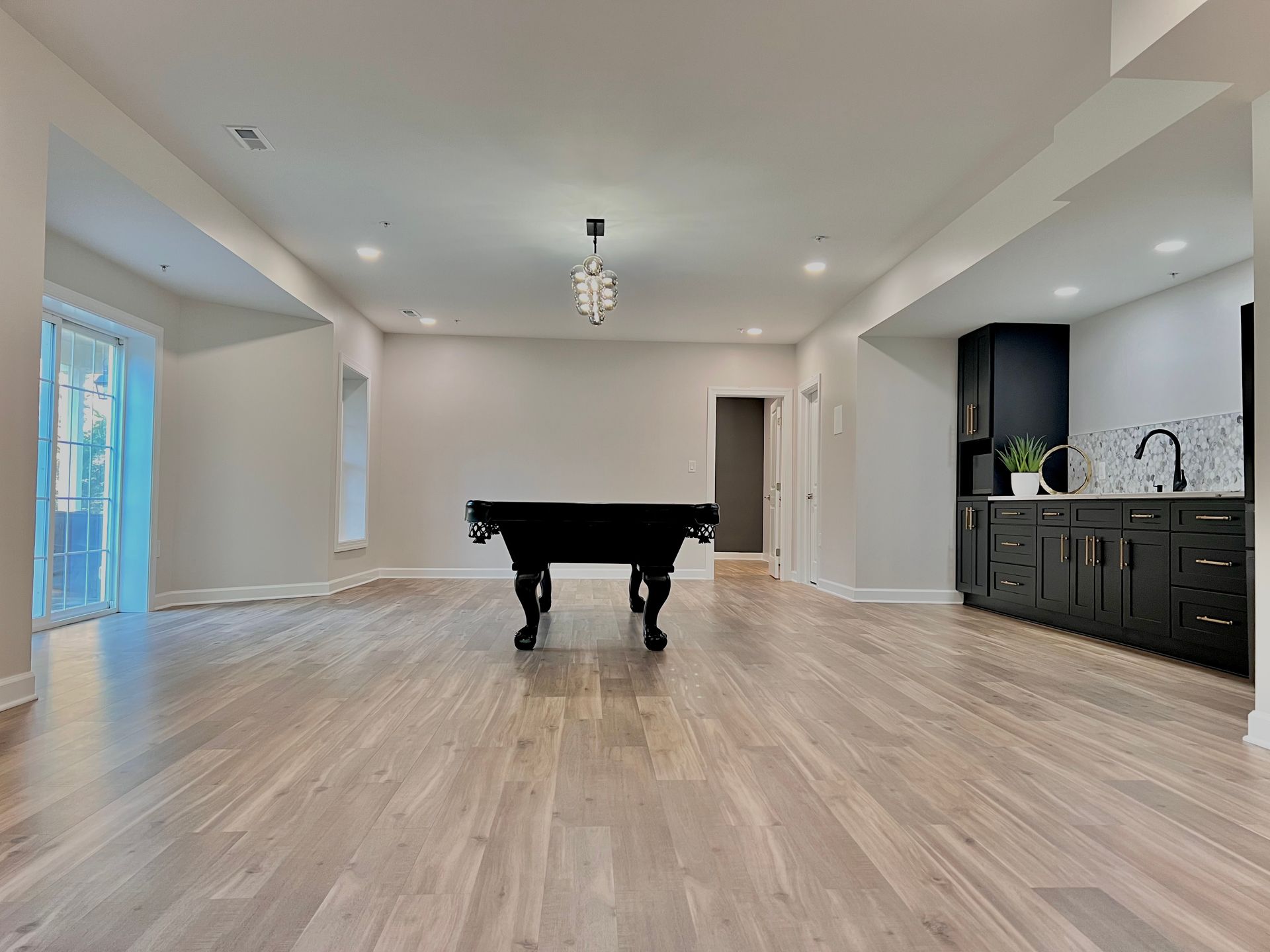 New Basement Flooring Installation in Ellicott City MD. Vinyl, Tile, and Carpet.