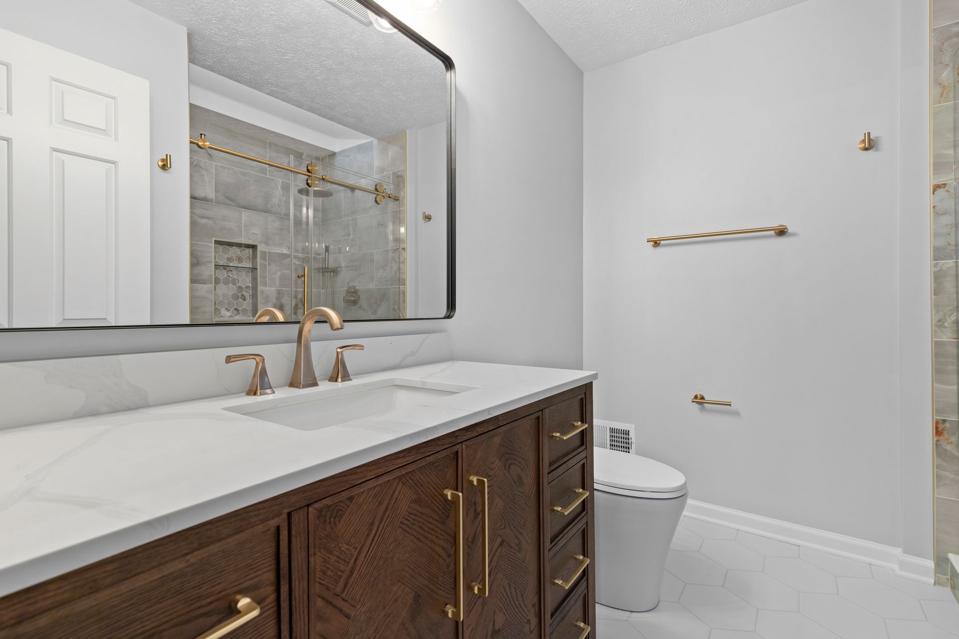 A complete view of a modern bathroom renovation in Bel Air, MD, featuring a custom-sized walk-in shower that replaced an old Jacuzzi tub.