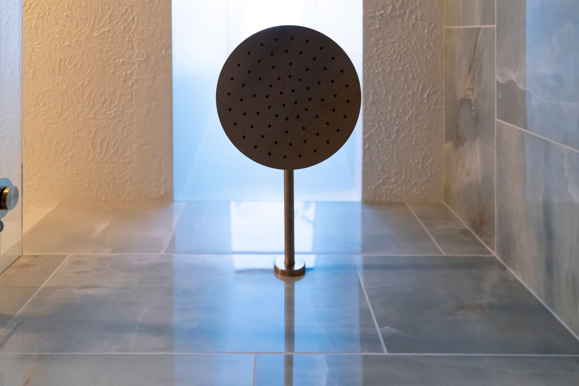 High-quality brushed nickel shower hardware and control valves installed for a long-lasting, modern look.