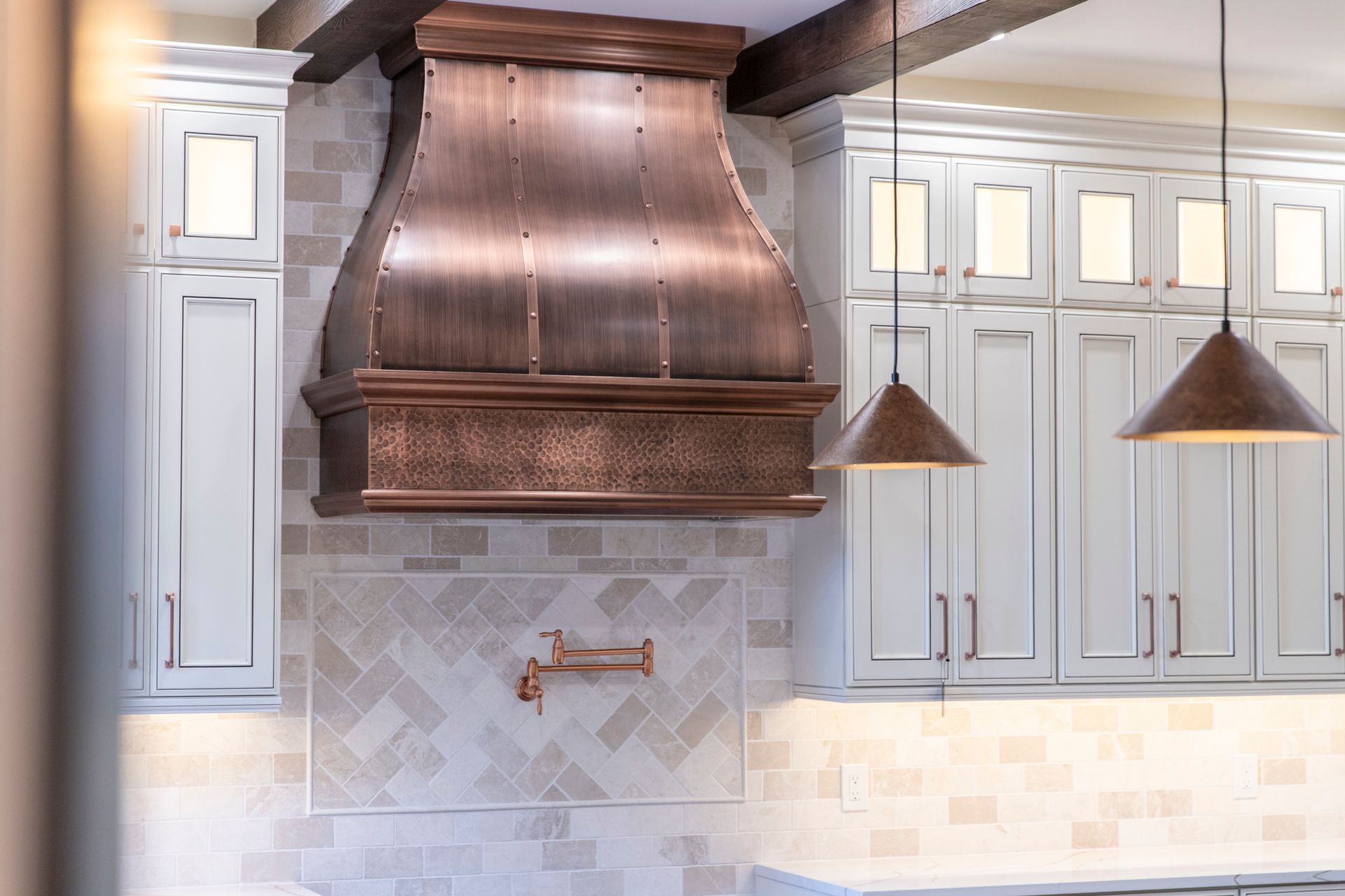 A view of the custom-built shelving unit next to the fireplace, demonstrating smart use of space.