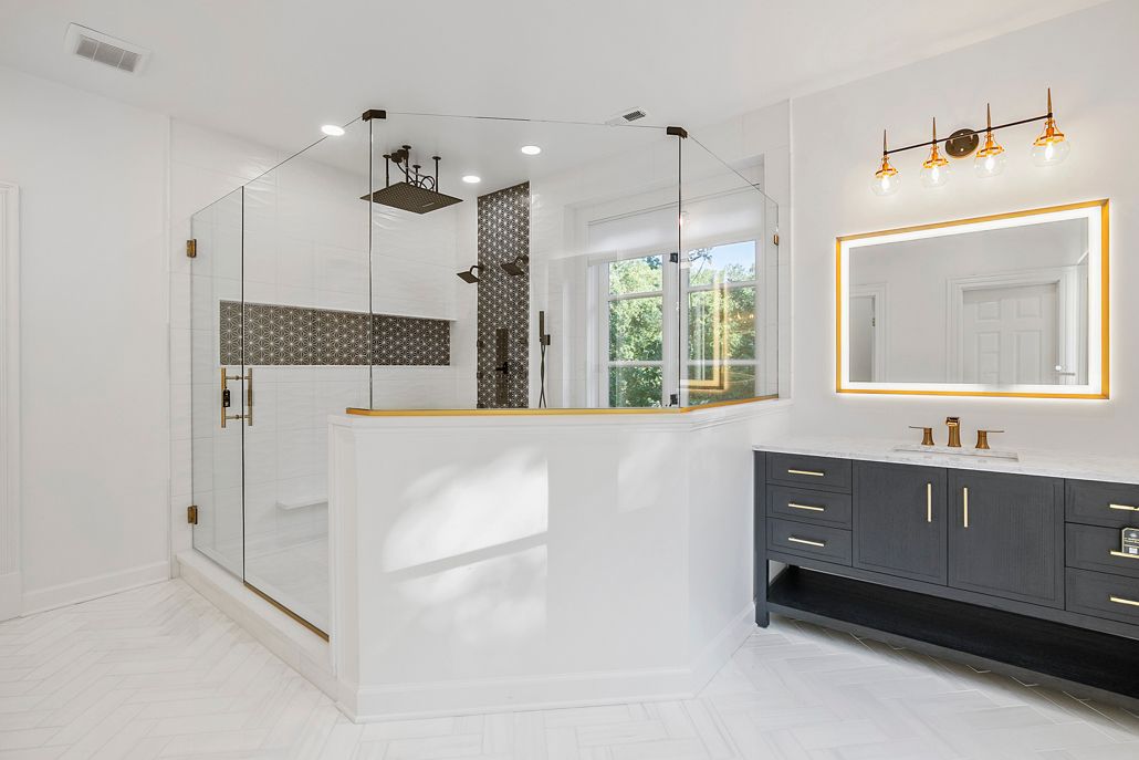 Modern bathroom remodeling in Cockeysville, featuring a custom shower with a unique black and white tile wall and a new dark vanity.