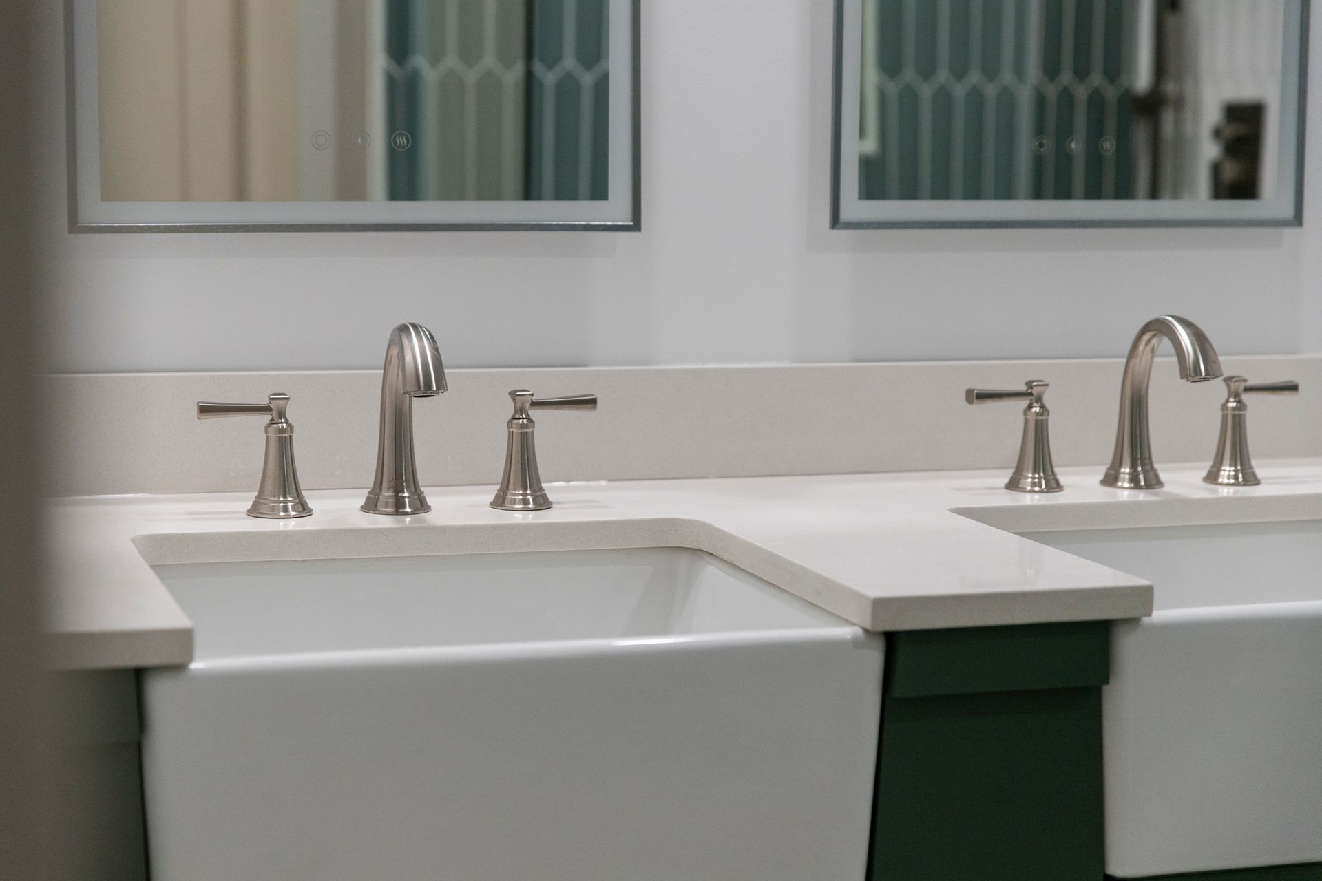 Handcrafted custom vanity solutions in unique colors like deep forest green, built with integrated storage and durable, easy-to-clean surfaces.