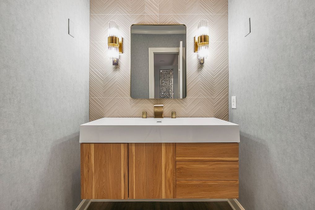 Efficient powder room upgrades focusing on new, water-saving toilets and durable wall finishes in MD.