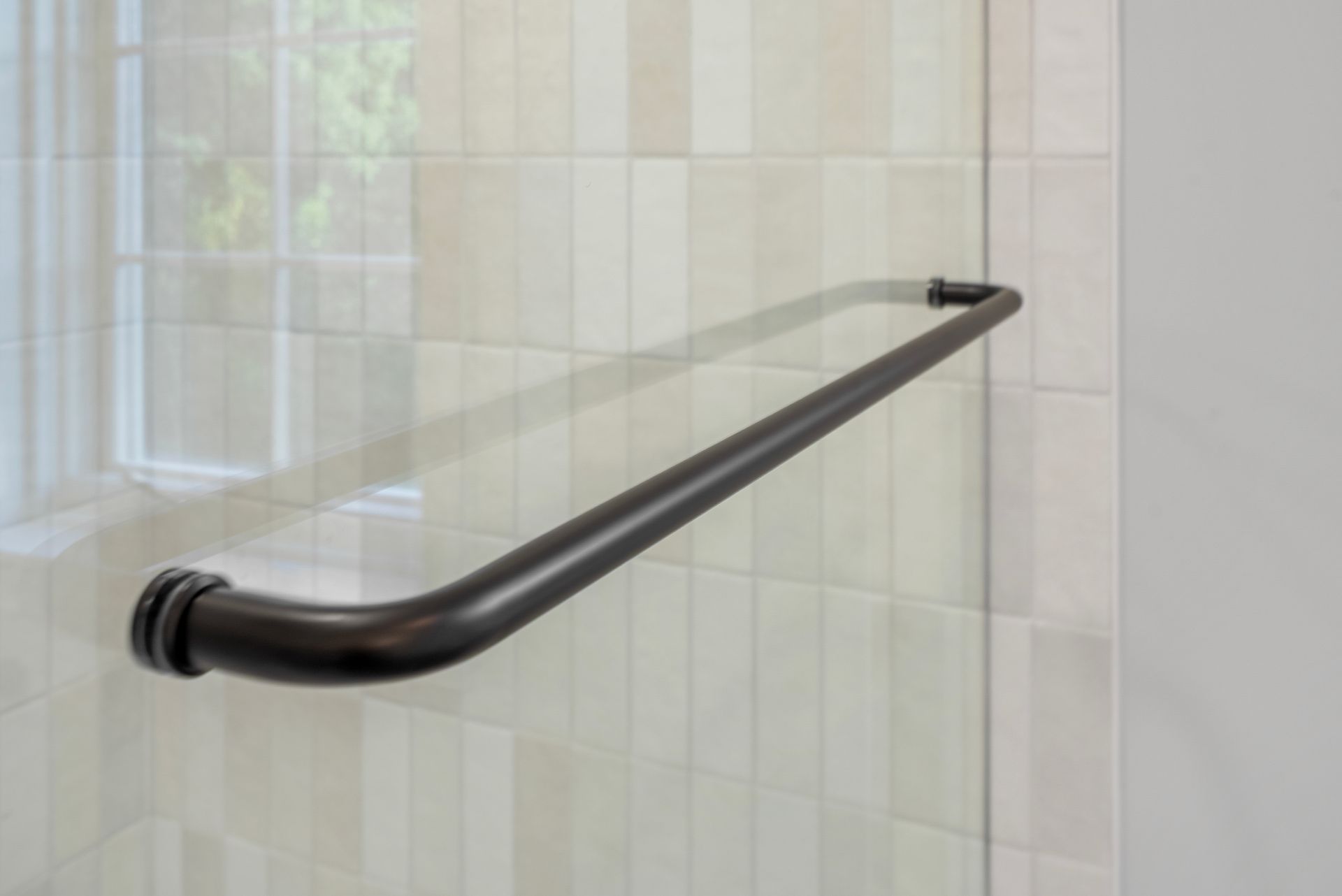 Bold geometric patterned shower floor tile in a newly remodeled Maryland bathroom
