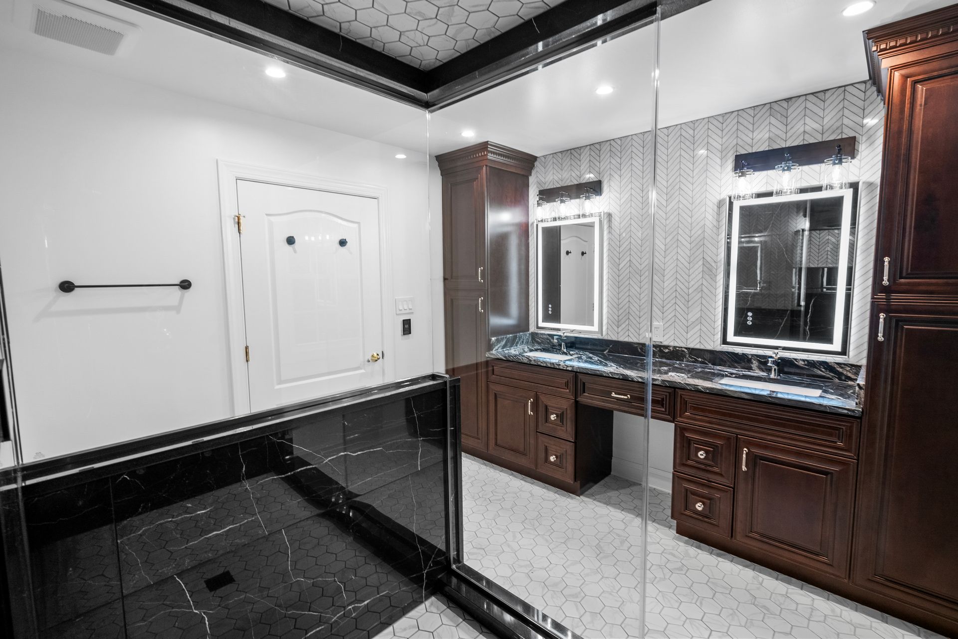 Overall view of completed luxury primary bathroom remodel with steam shower and double vanity