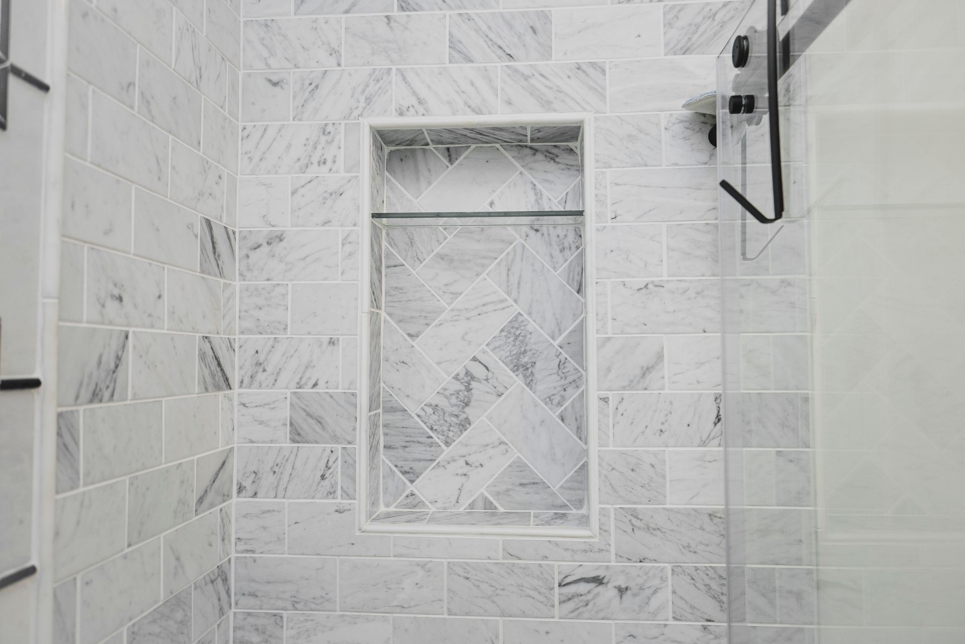 Modern bathtub area with a high-contrast black and white design.