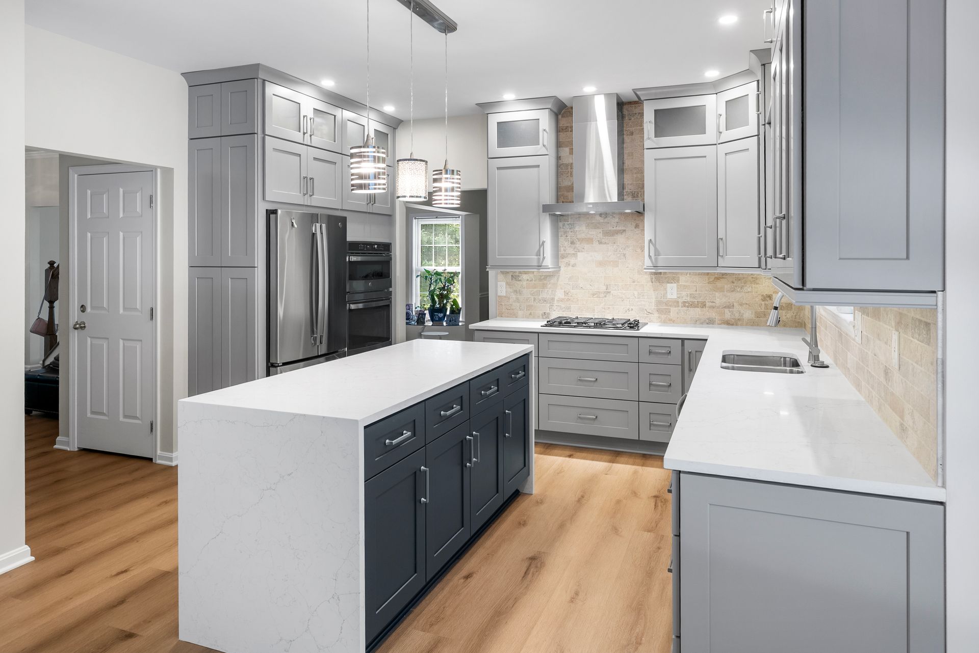 High-end open floor plan kitchen renovation in Timonium MD matching modern Baltimore County design trends.