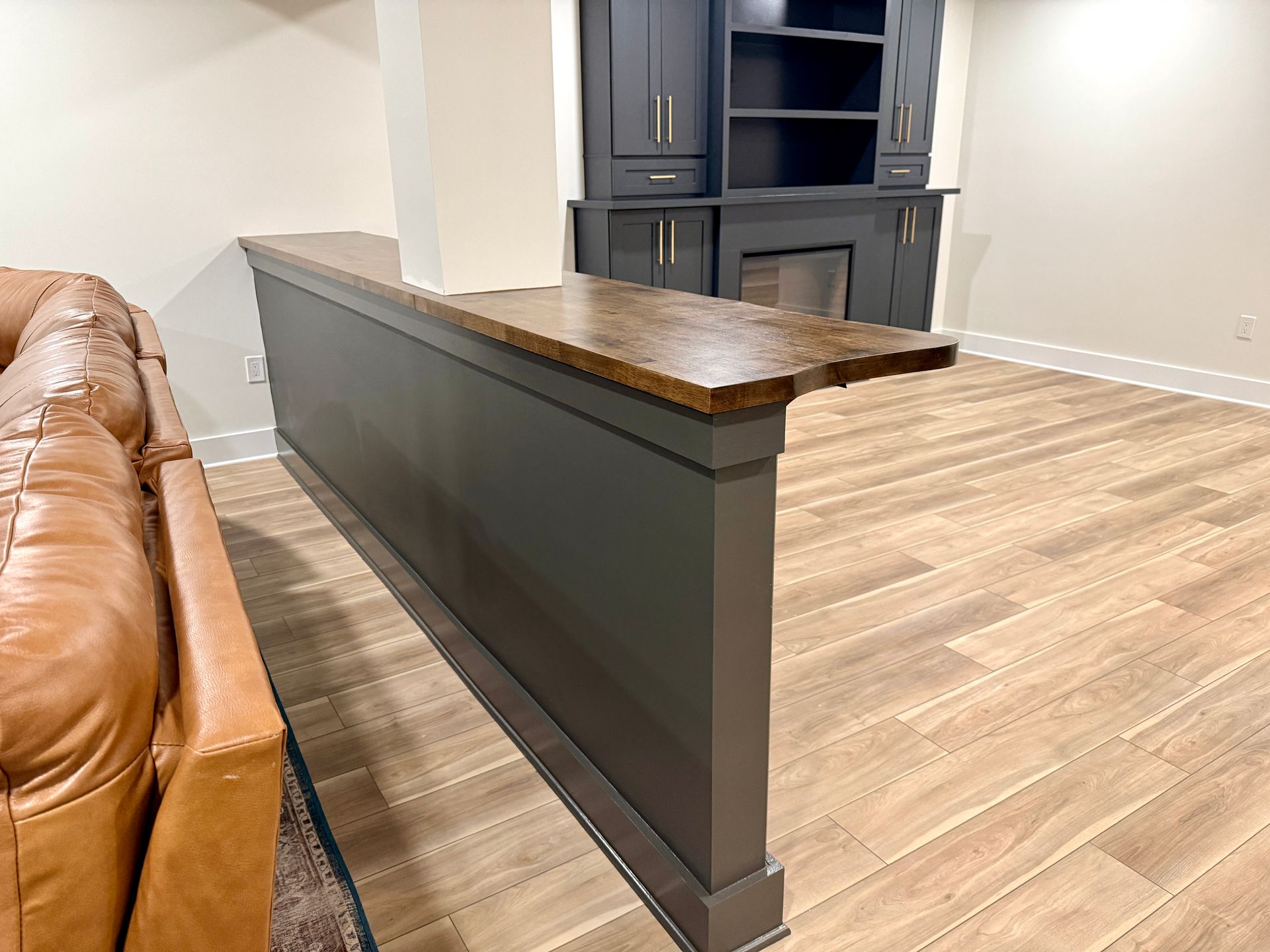Hand-stained butcher block bar top for basement entertainment area.