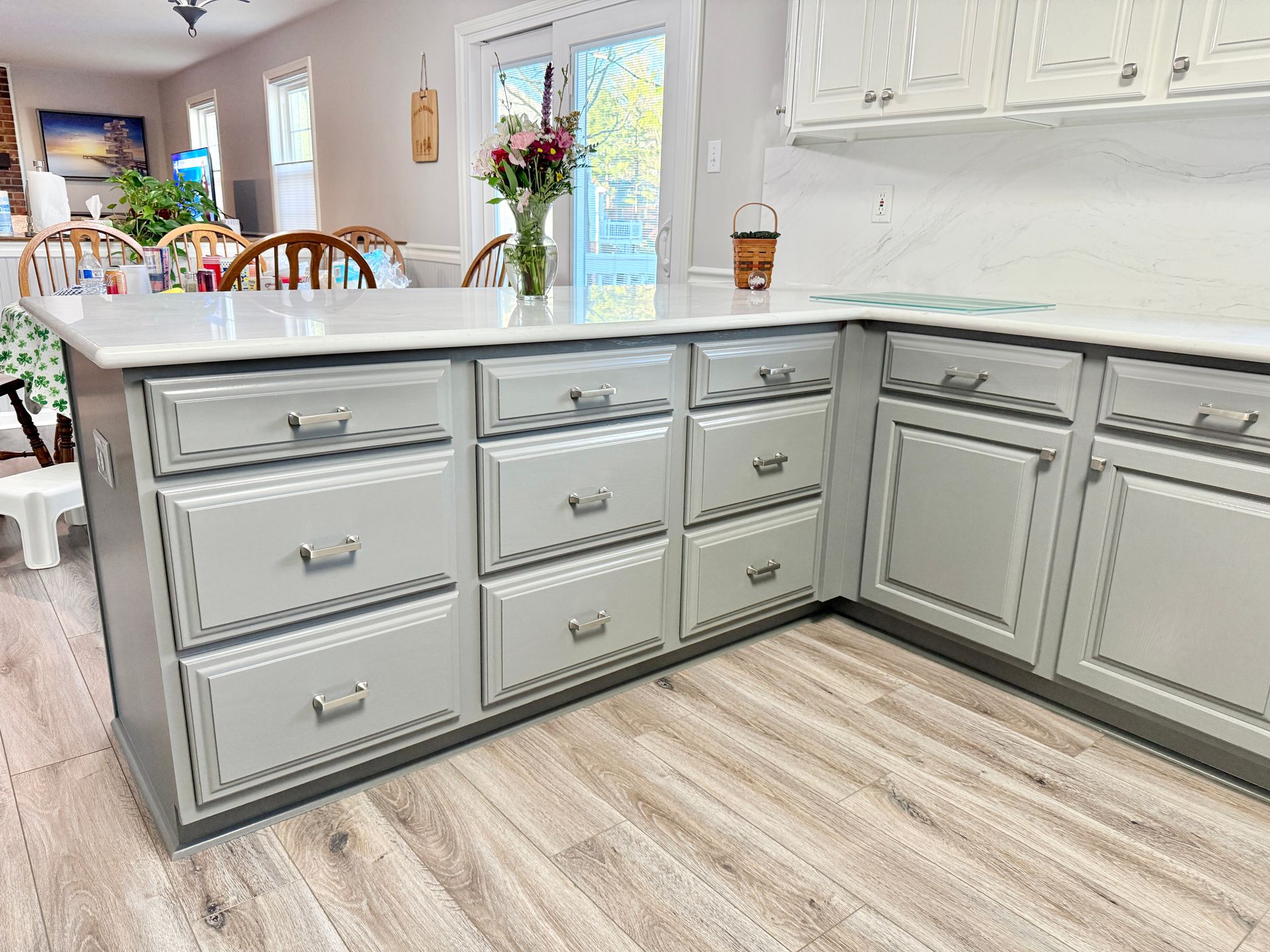 A complete modern update featuring two-tone cabinets and quartz surfaces.