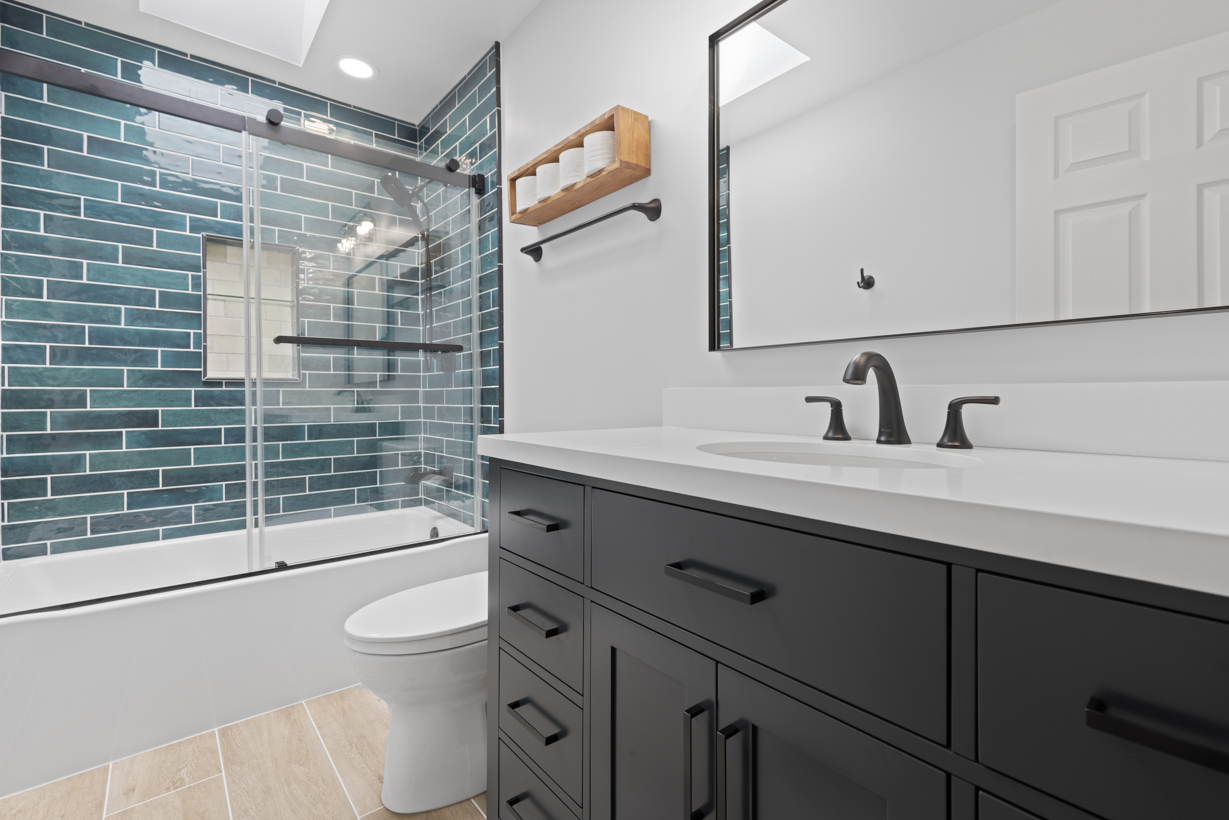 Professional bathroom remodeling in Ellicott City, MD, showcasing a complete transformation with modern tiles, vanity, and fixtures.