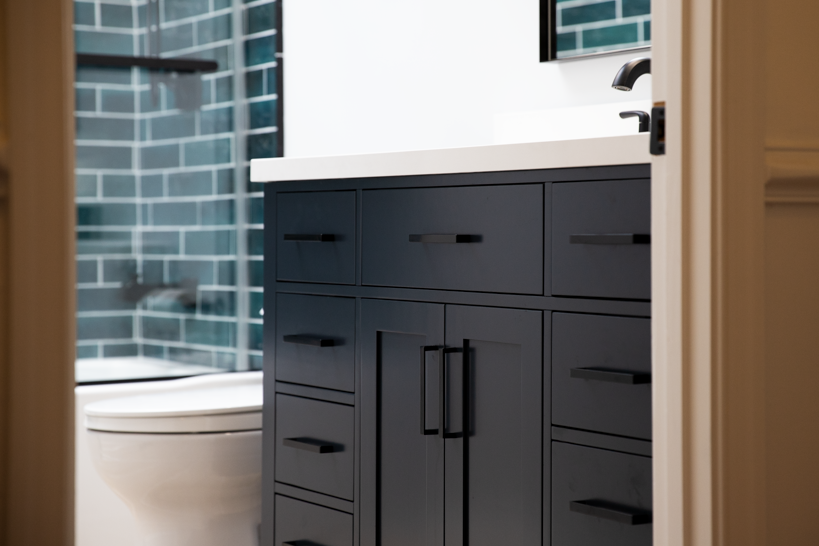 High-quality vanity replacement and installation in Ellicott City, MD, framed by the door to showcase a complete renovation.