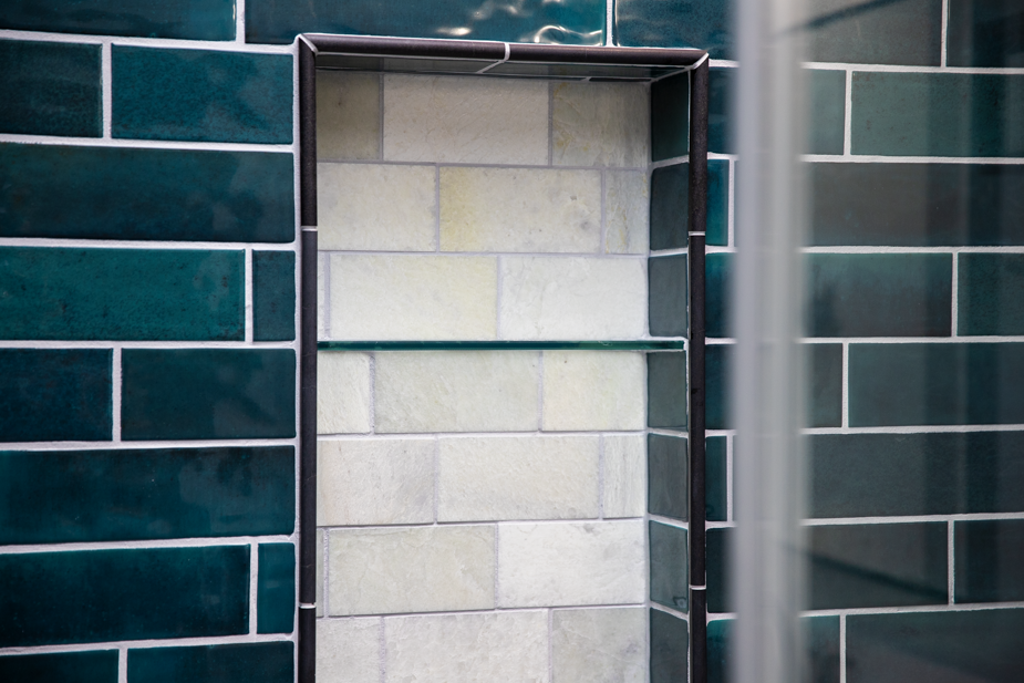 Creative shower niche installation by Ellicott City, MD remodelers, adding practical and aesthetic value to your shower.