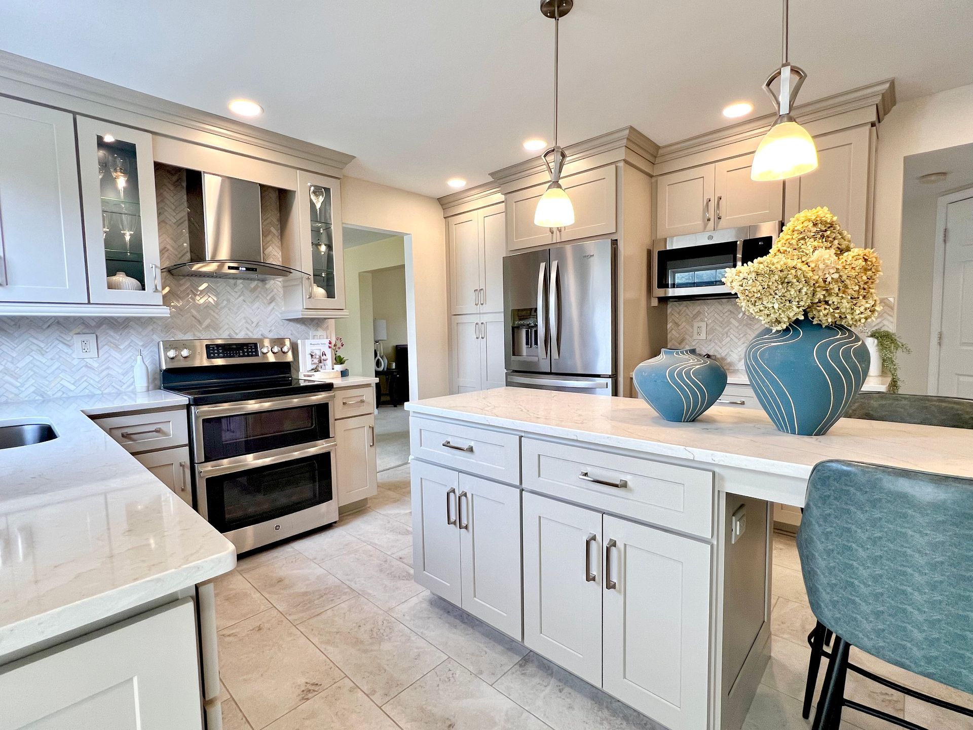 Complete kitchen remodel in Sykesville, MD, showcasing a large island, updated cabinets, and modern finishes.