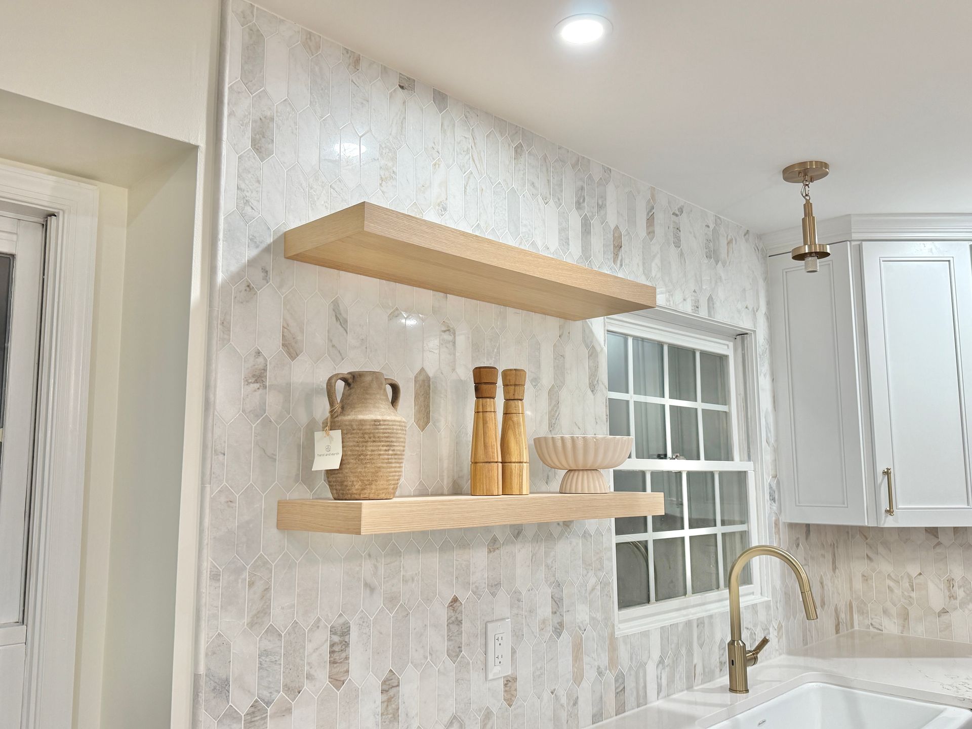 Custom kitchen bar area featuring cabinetry and integrated beverage refrigerators.