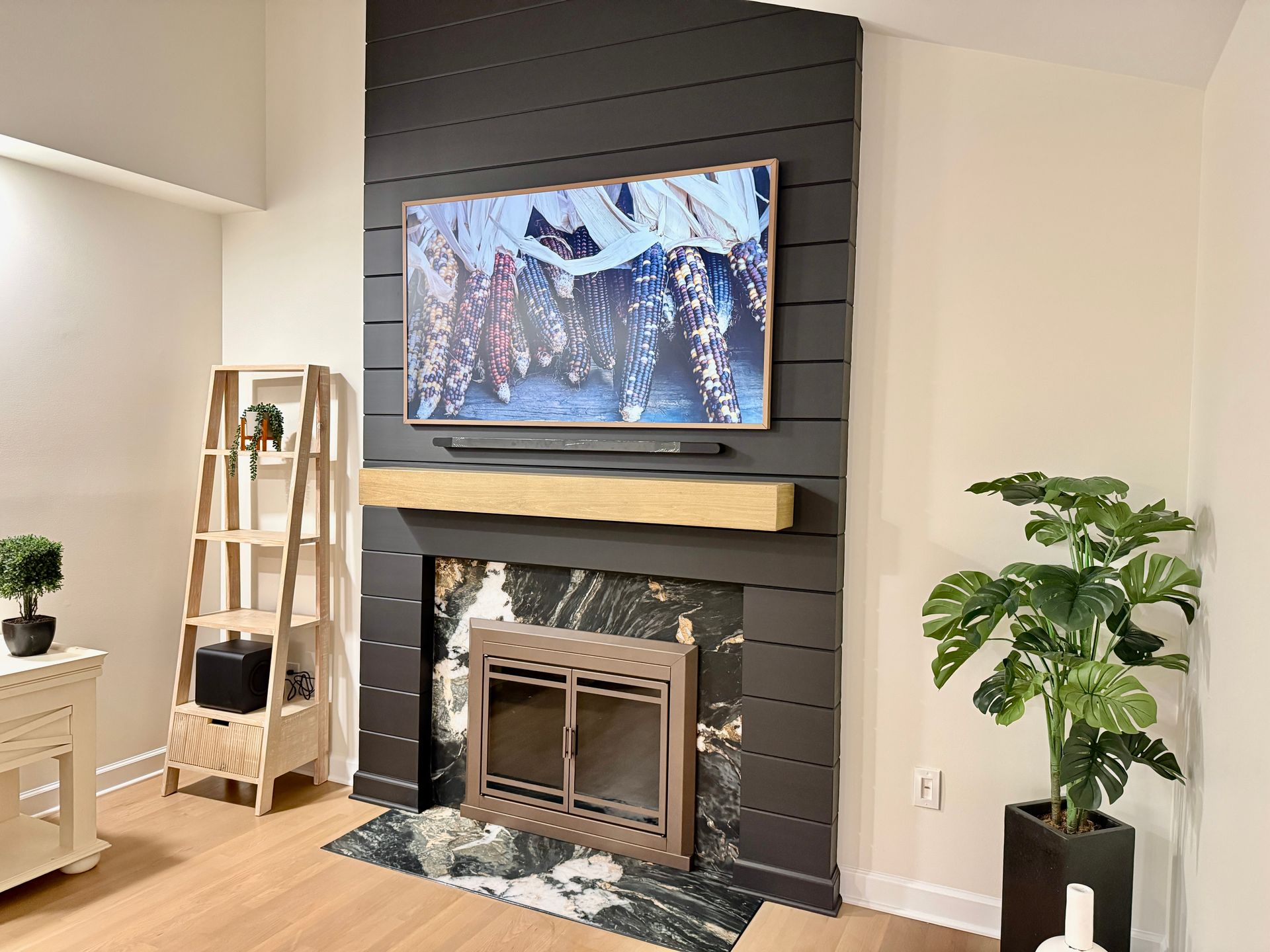 Full room view of Monkton Custom Fireplace Remodeling project near sliding glass door.