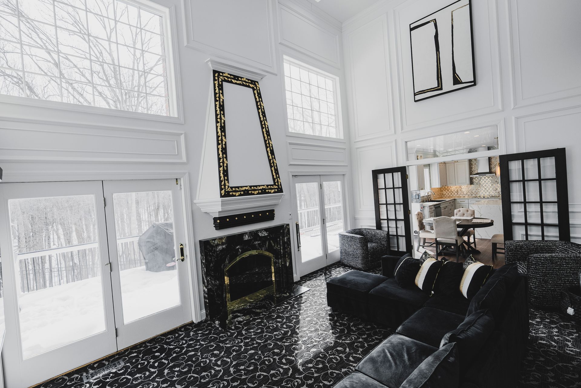 Bright, airy living room layout featuring a balance of artisan wood work and modern stone.