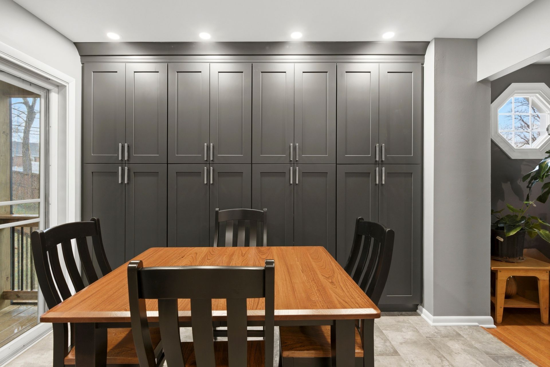 Fully renovated kitchen workspace with updated lighting and flooring.