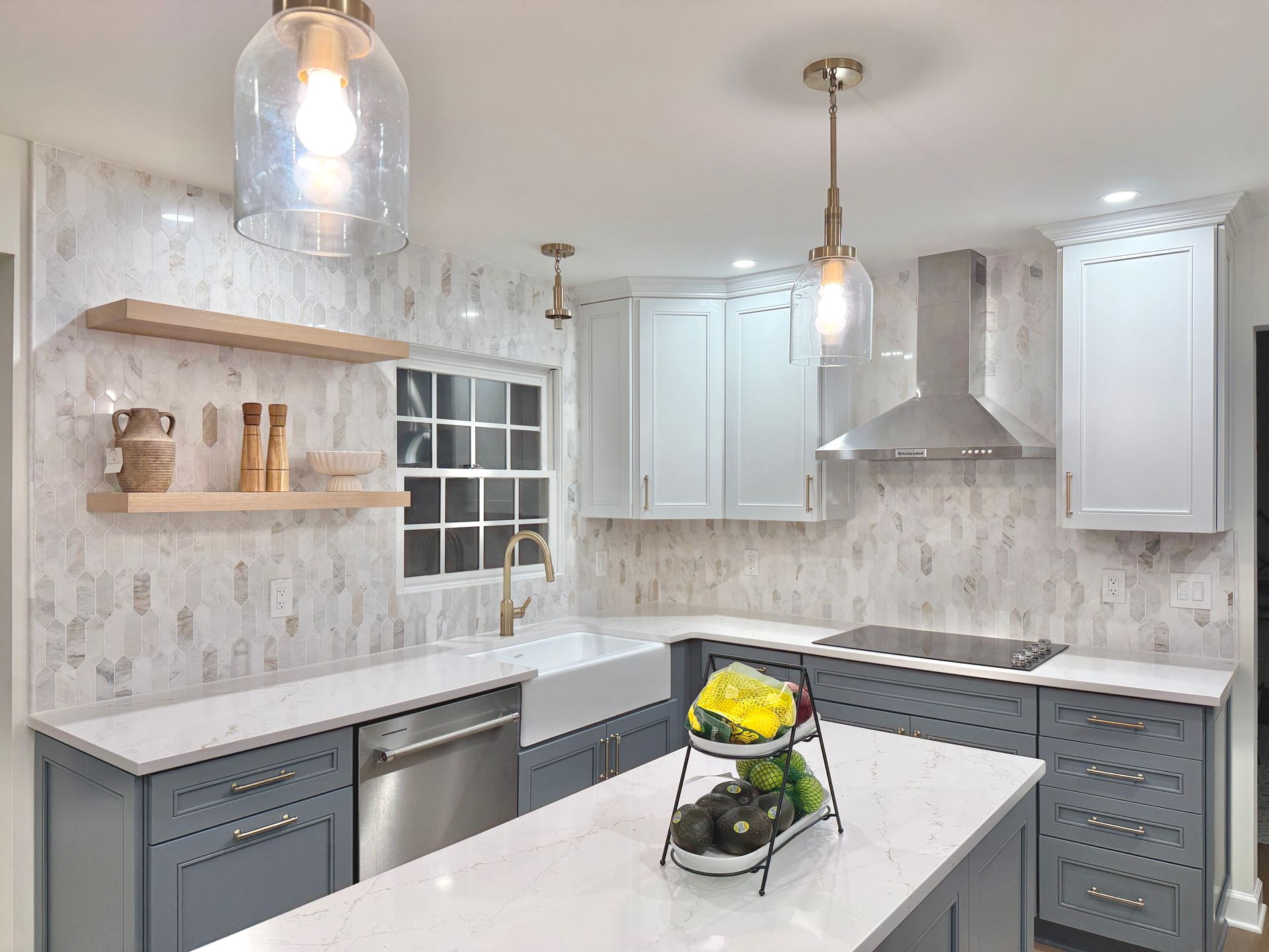 Flawlessly installed farmhouse sink and floating wood shelves by the kitchen window.
