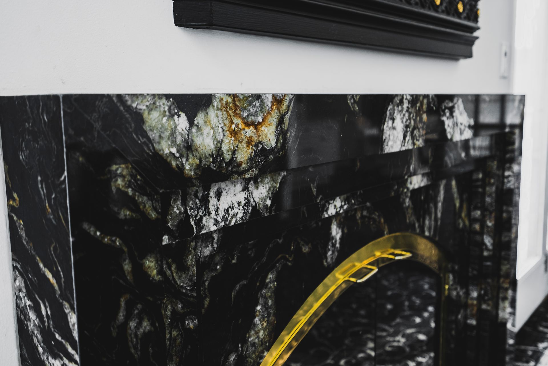 Comprehensive view of an open-concept living area with new floors, walls, and custom carpentry.