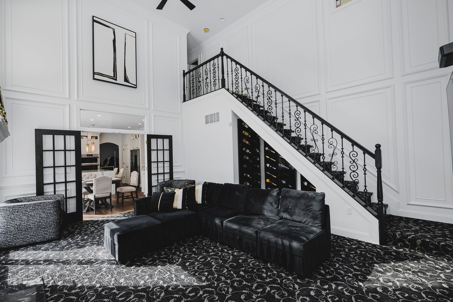 A complete interior transformation featuring floor-to-ceiling picture frame moldings and artisan trim.