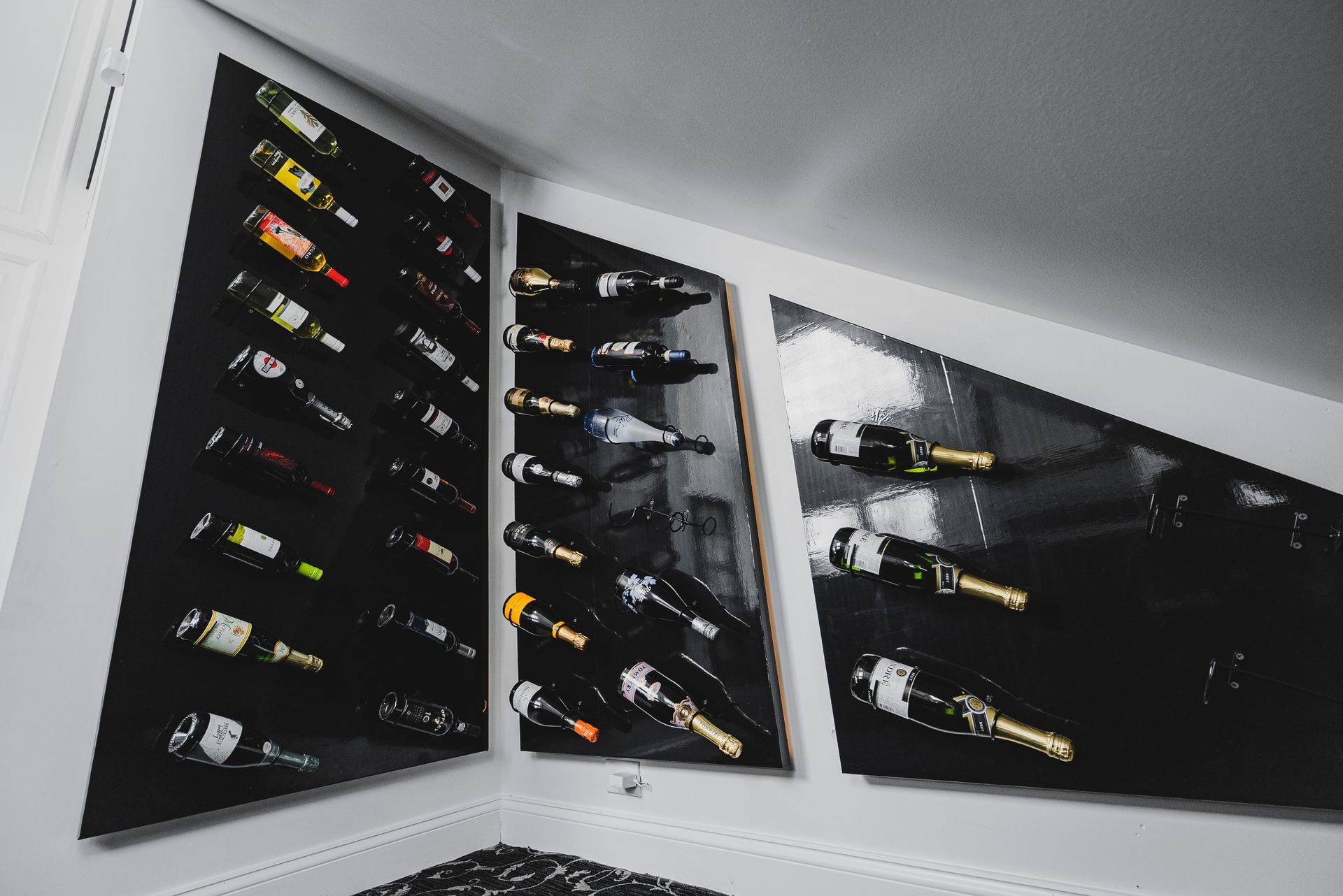 Precision-cut wooden columns framing a custom stone fireplace hearth and surround.