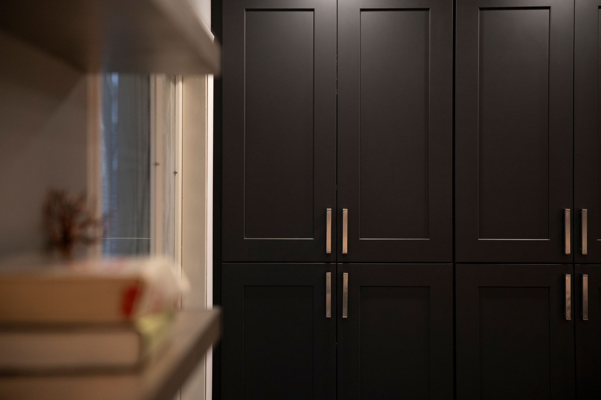 Using recessed lighting and light-toned finishes to modernize a home.