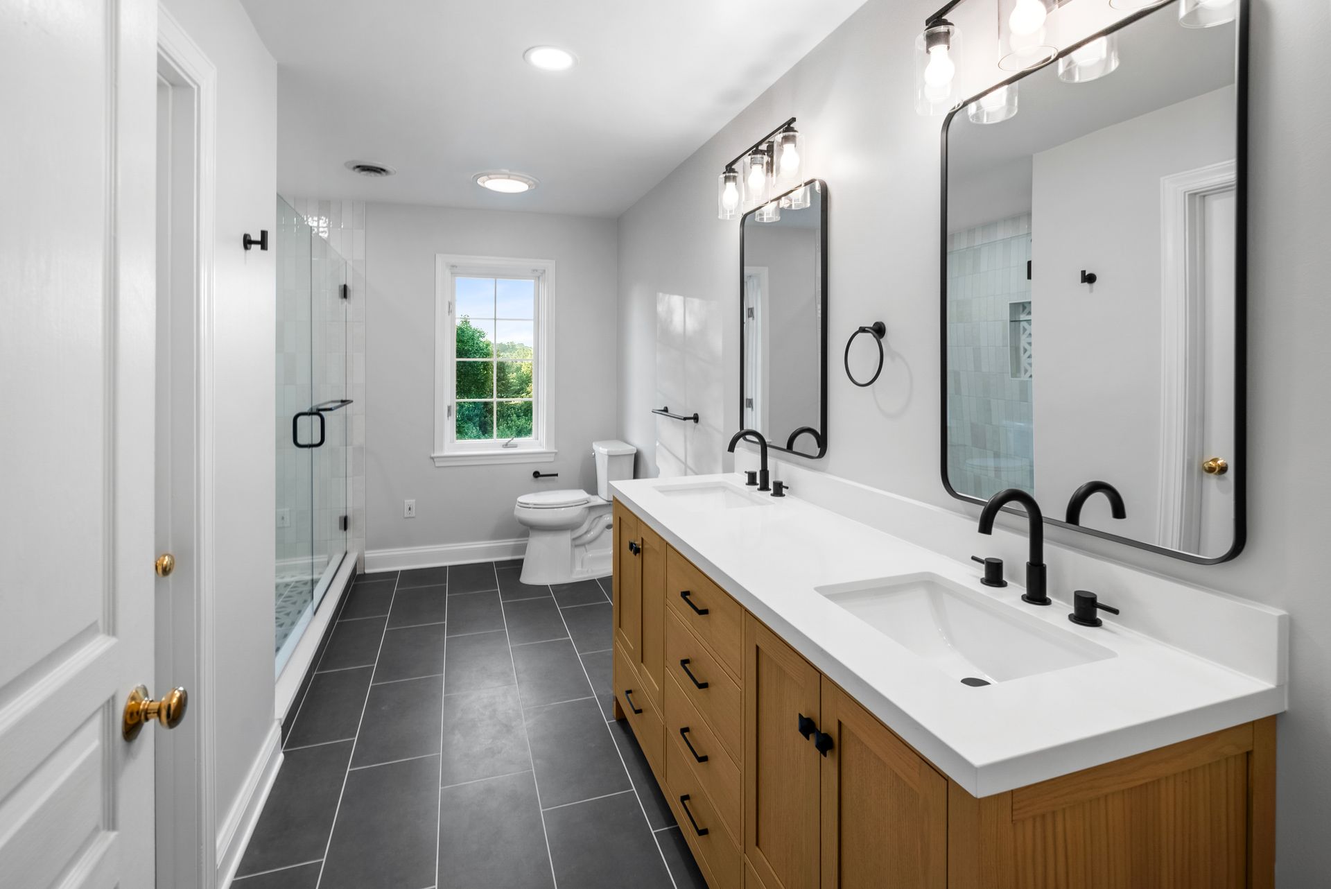 Crisp white quartz bathroom vanity countertop with undermount sinks and modern faucets