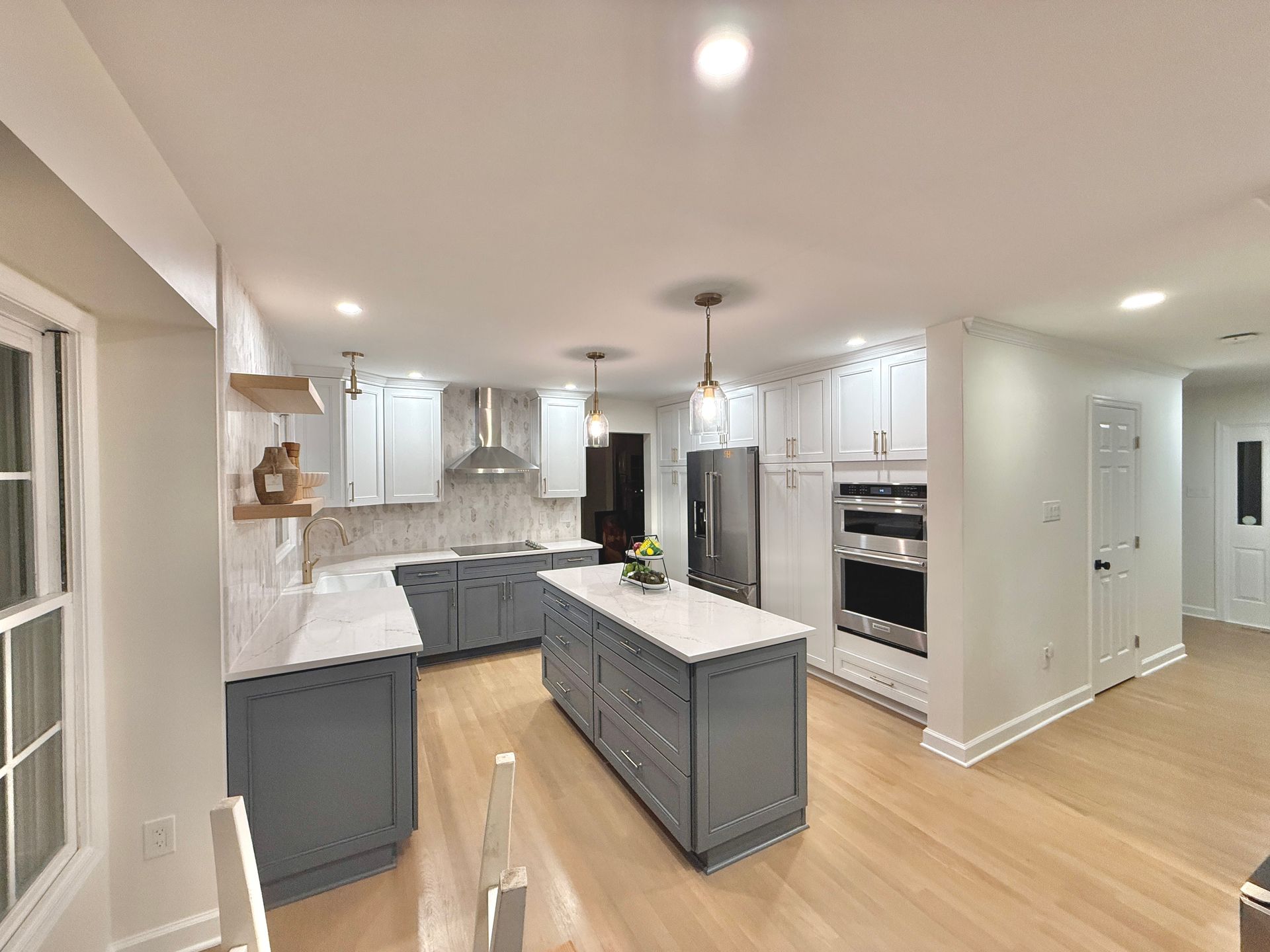 Flawlessly installed tile backsplash and range hood, correcting poor previous tile work.