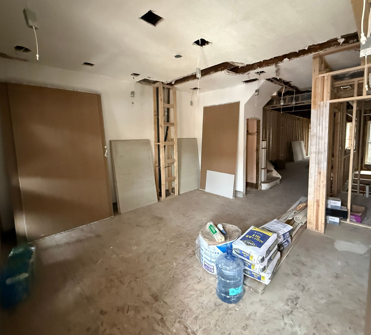 Modern residential renovation project with an open layout and new flooring.