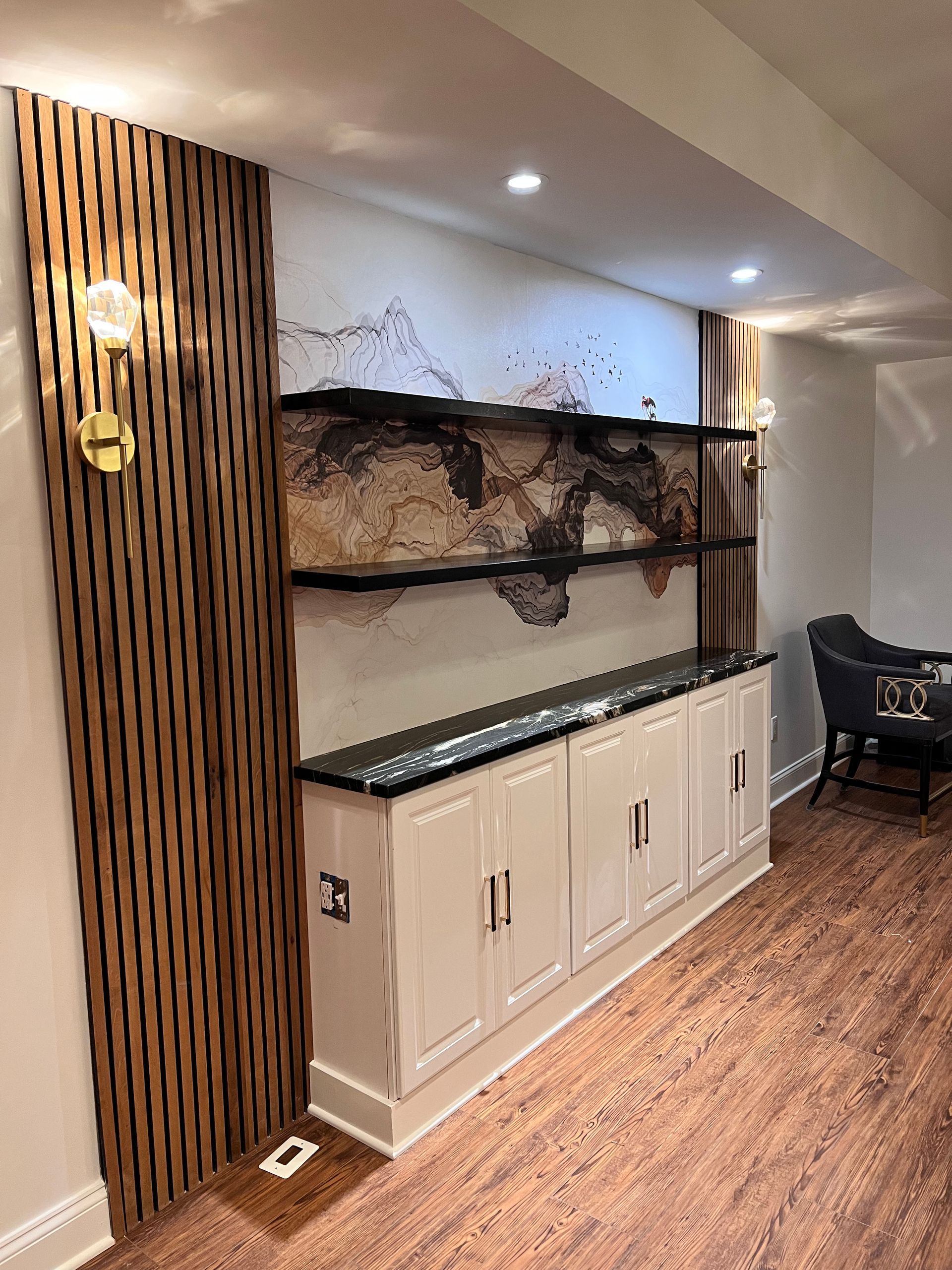 Custom-built media wall with integrated shelving and cabinets, providing ample storage and a clean aesthetic in Fallston, MD