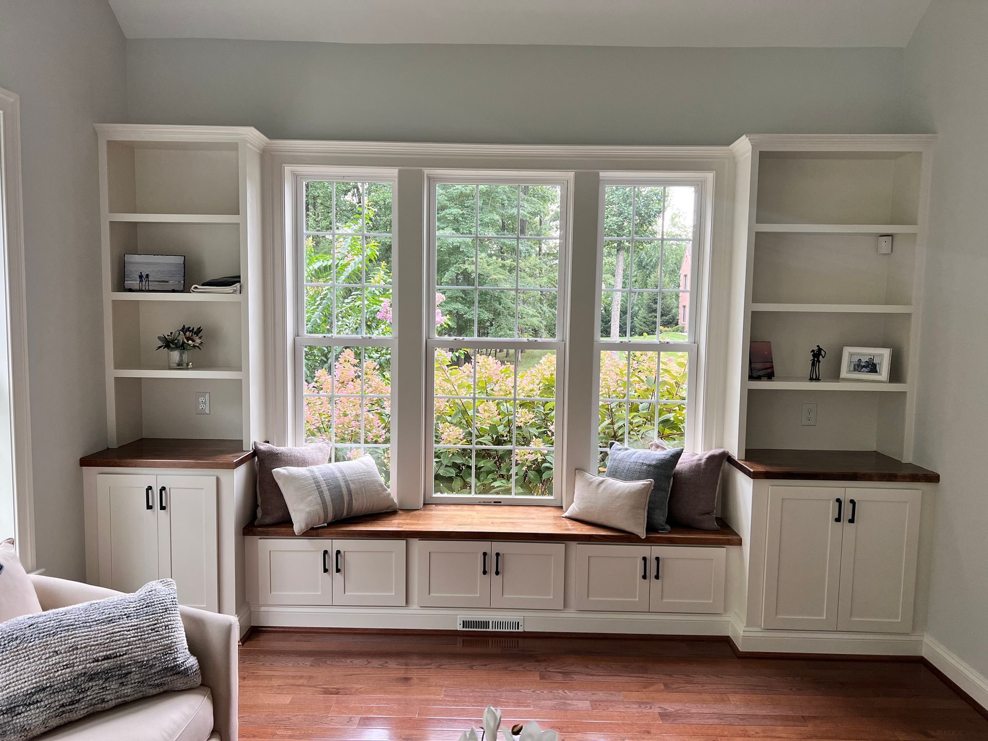 Custom built-in bookshelves surrounding a window in Fallston home, Maryland.