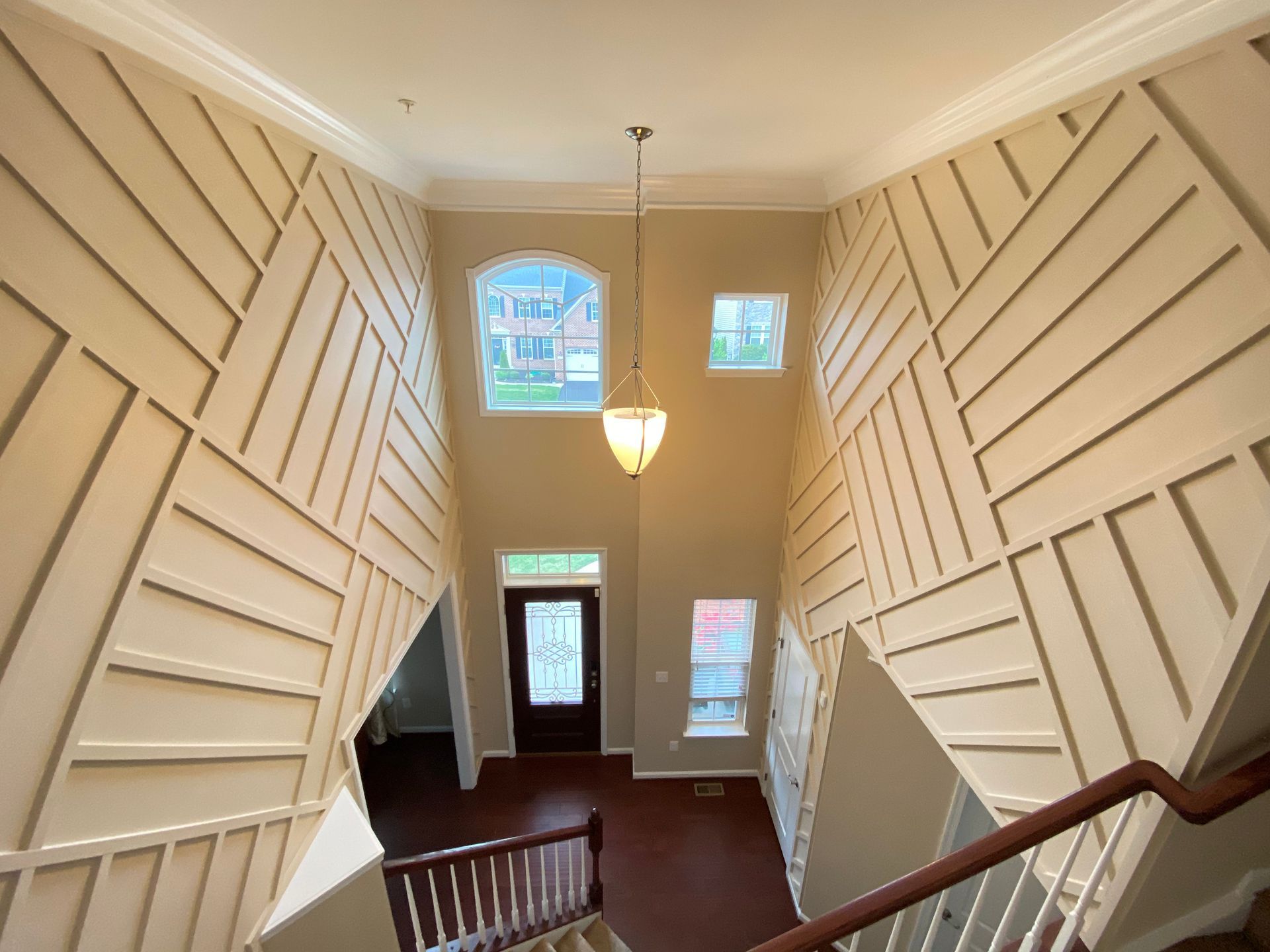 Wainscoting installation in a foyer in Fallston, MD, extending to the ceiling.