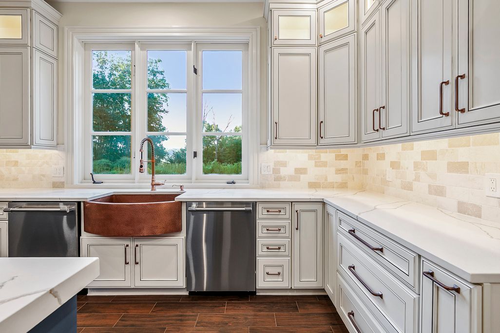 Transitional kitchen remodel for Baltimore Row House. Copper farmhouse sink, subway tile.