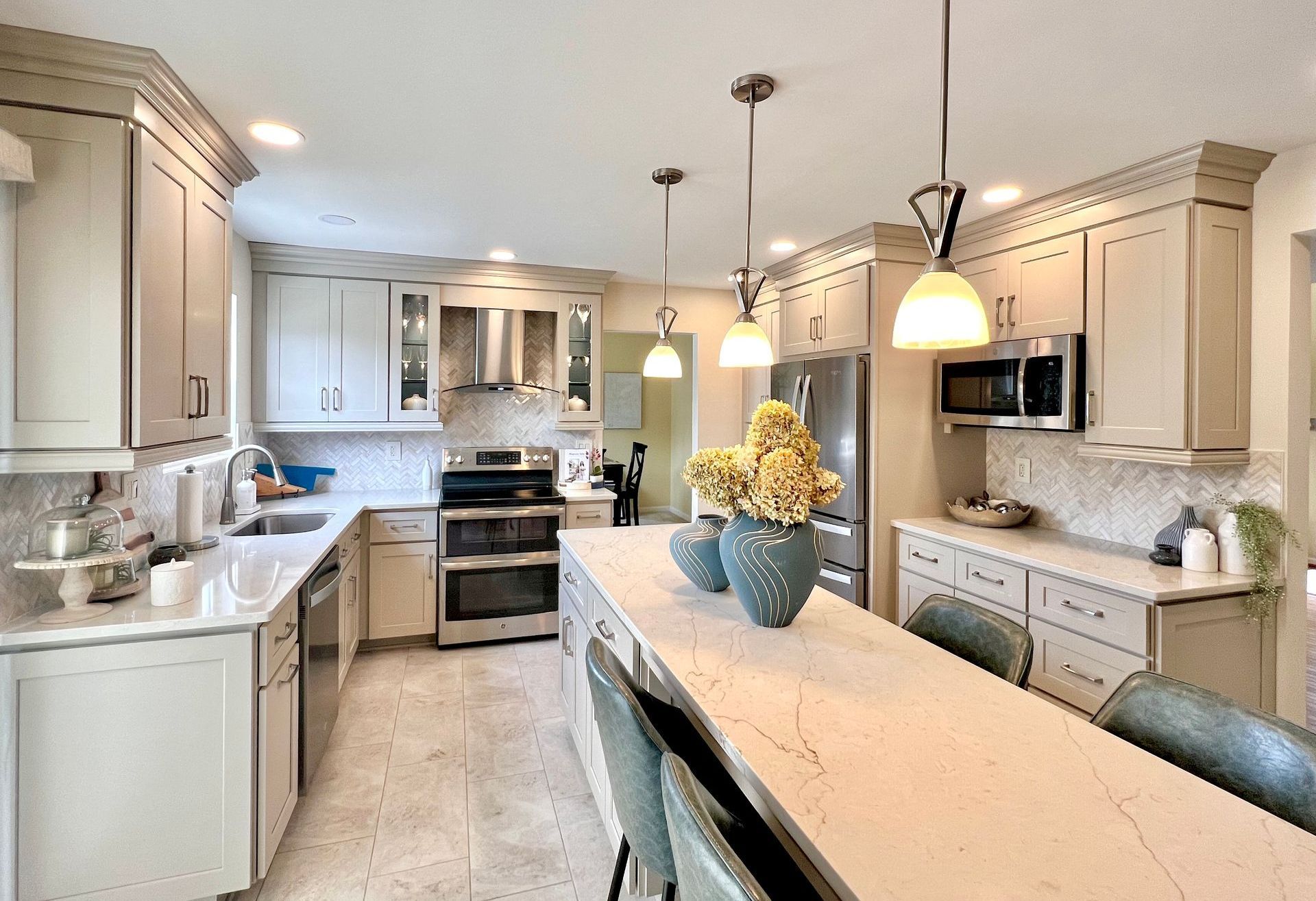 Sykesville kitchen remodel: Light gray cabinets, island, stainless steel.
