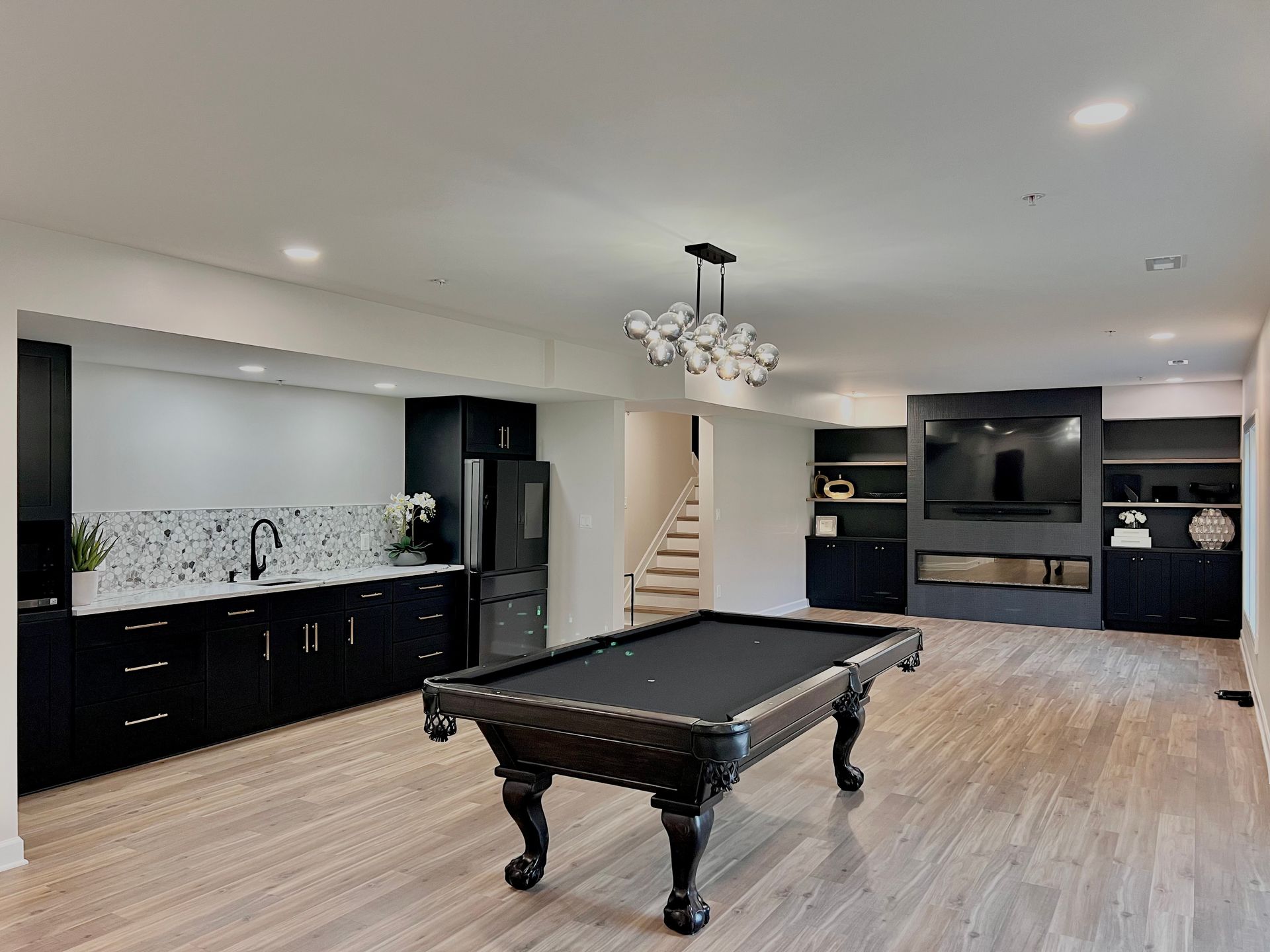 Professional installation of sub-floor system and vapor barrier for a guaranteed dry basement finish