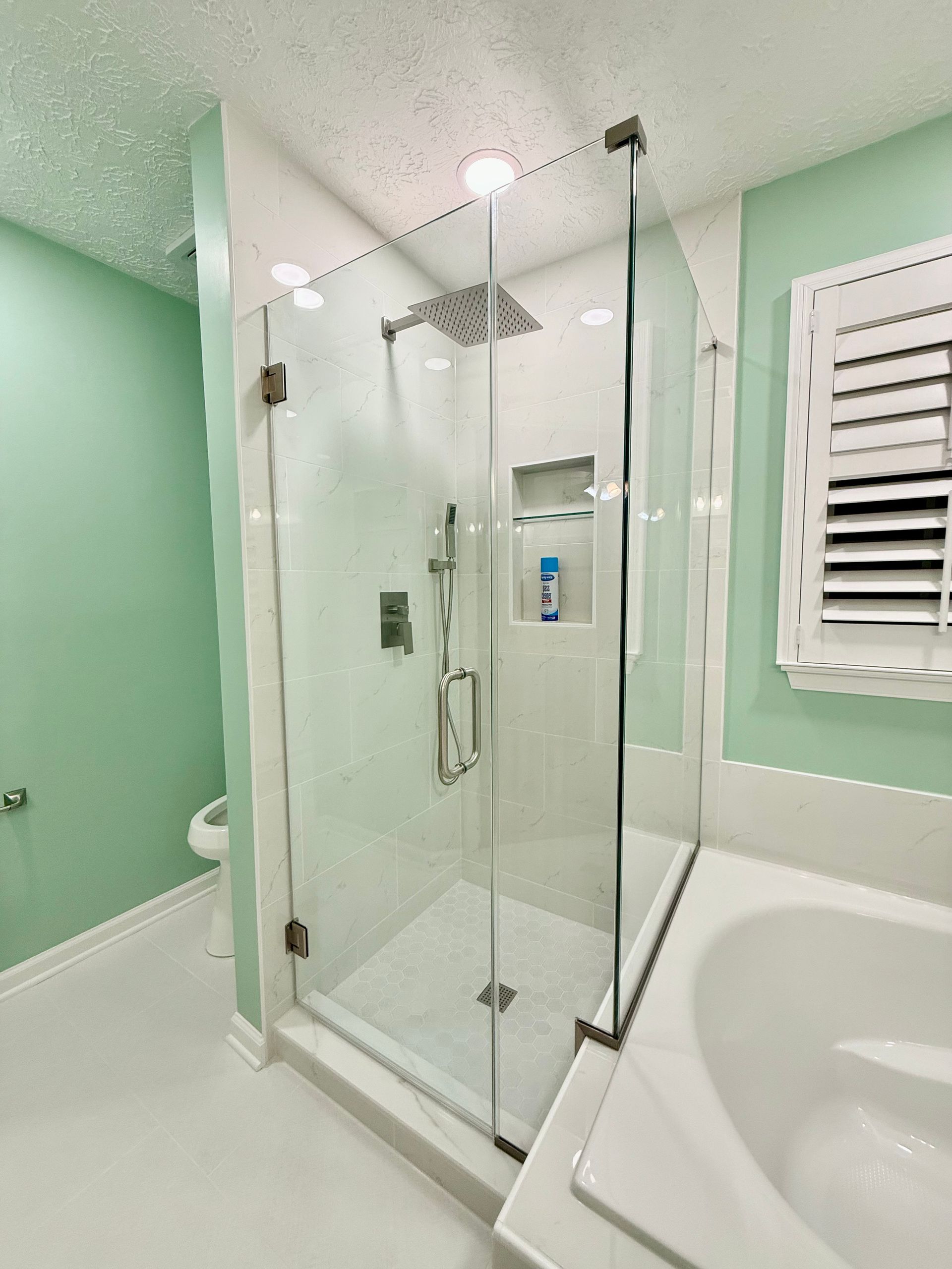 Precision installation of modern square shower valve and handheld fixture by our local bathroom remodeling pros.