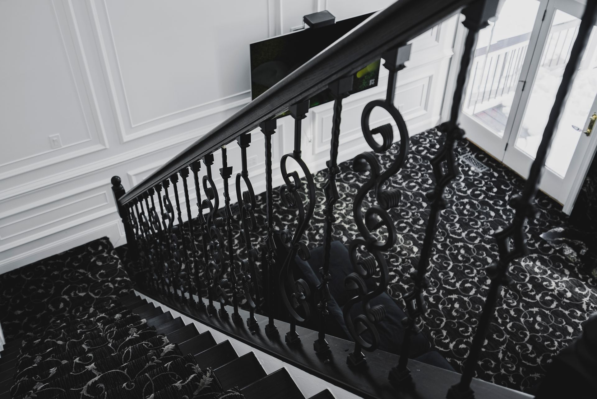 A grand living room focal point featuring a custom white mantel and quartz stone facing.