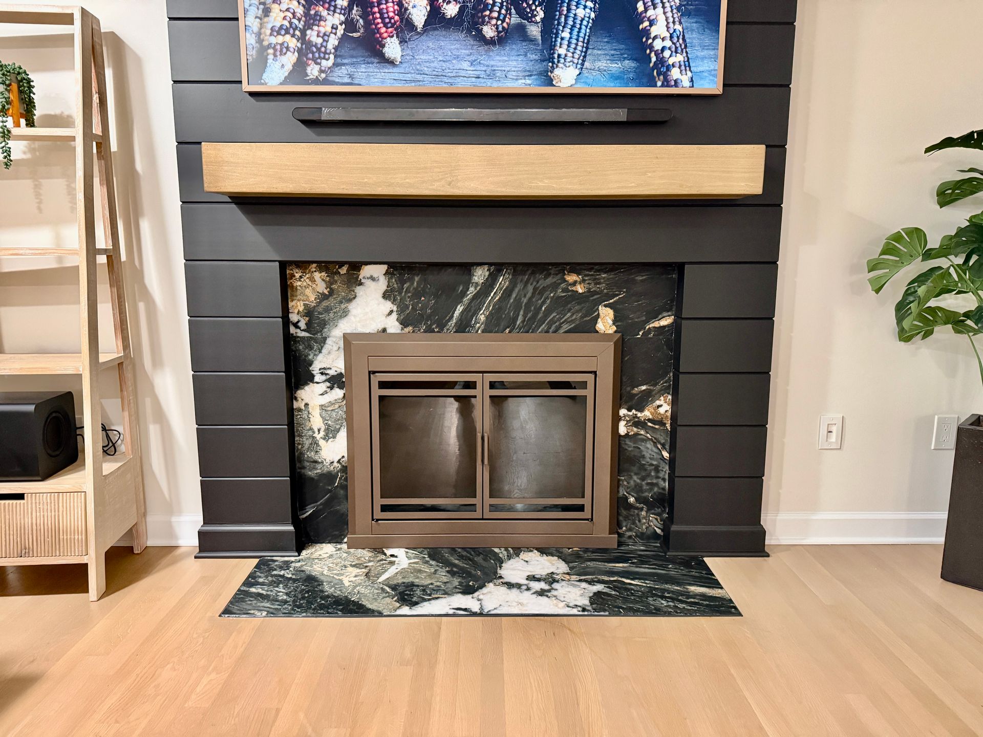 Monkton Custom Media Wall: featuring black shiplap and dramatic natural stone facing for a modern look.