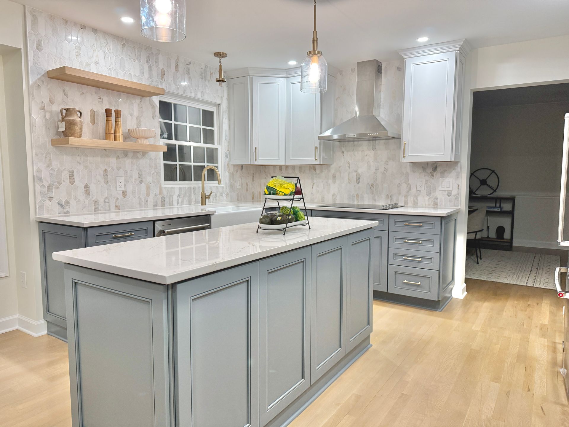 Custom kitchen island drawers installed with precision alignment, featuring high-quality brass hardware.