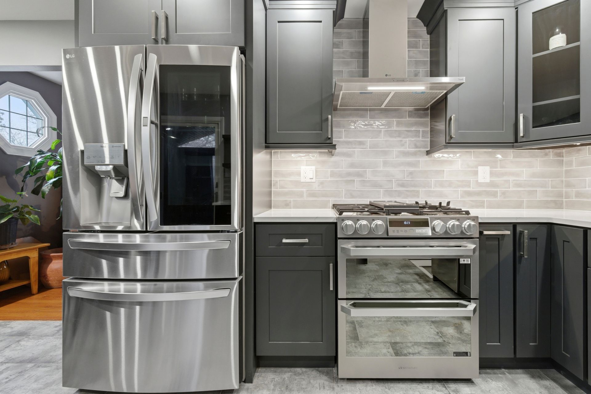 Complete kitchen modernization with new flooring, cabinets, and appliances.