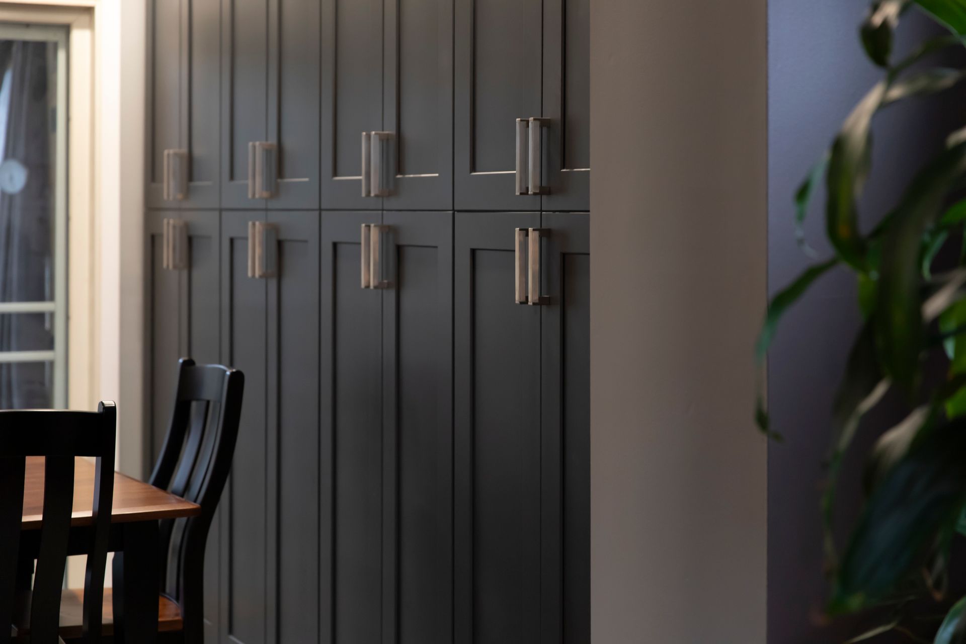 Removing ceiling bulkheads to create a more spacious and airy kitchen feel.