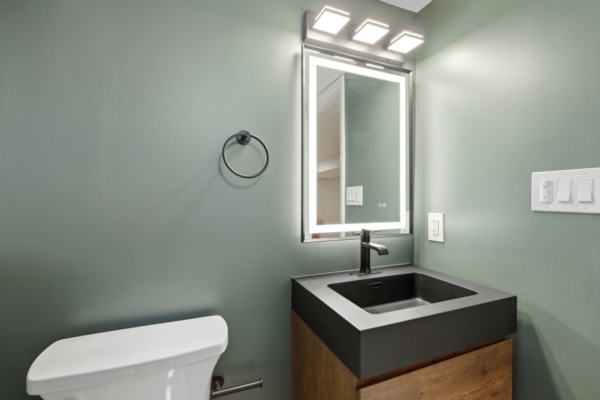 Cohesive design elements used across multiple rooms for a unified home aesthetic.