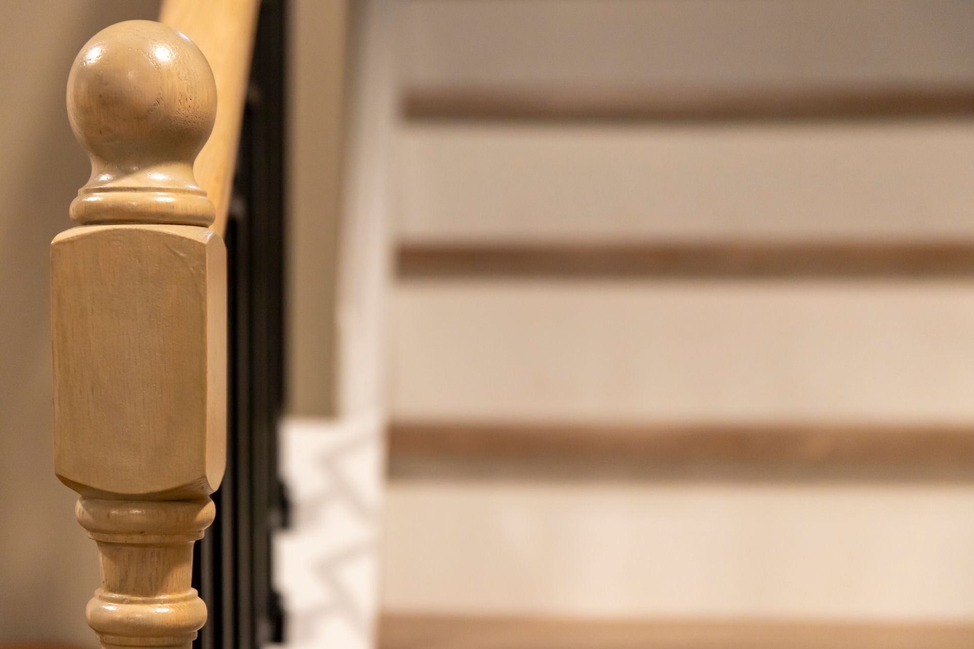 Finished Staircase Transformation: Fully remodeled basement stairs connecting the main floor to the new living area.