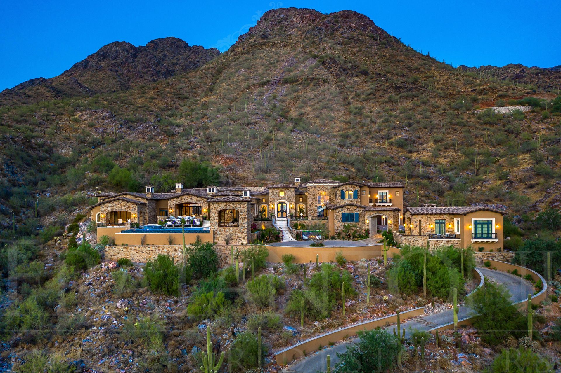 French style home resting on an elevation, resting against a mountainside in scottsdale, arizona