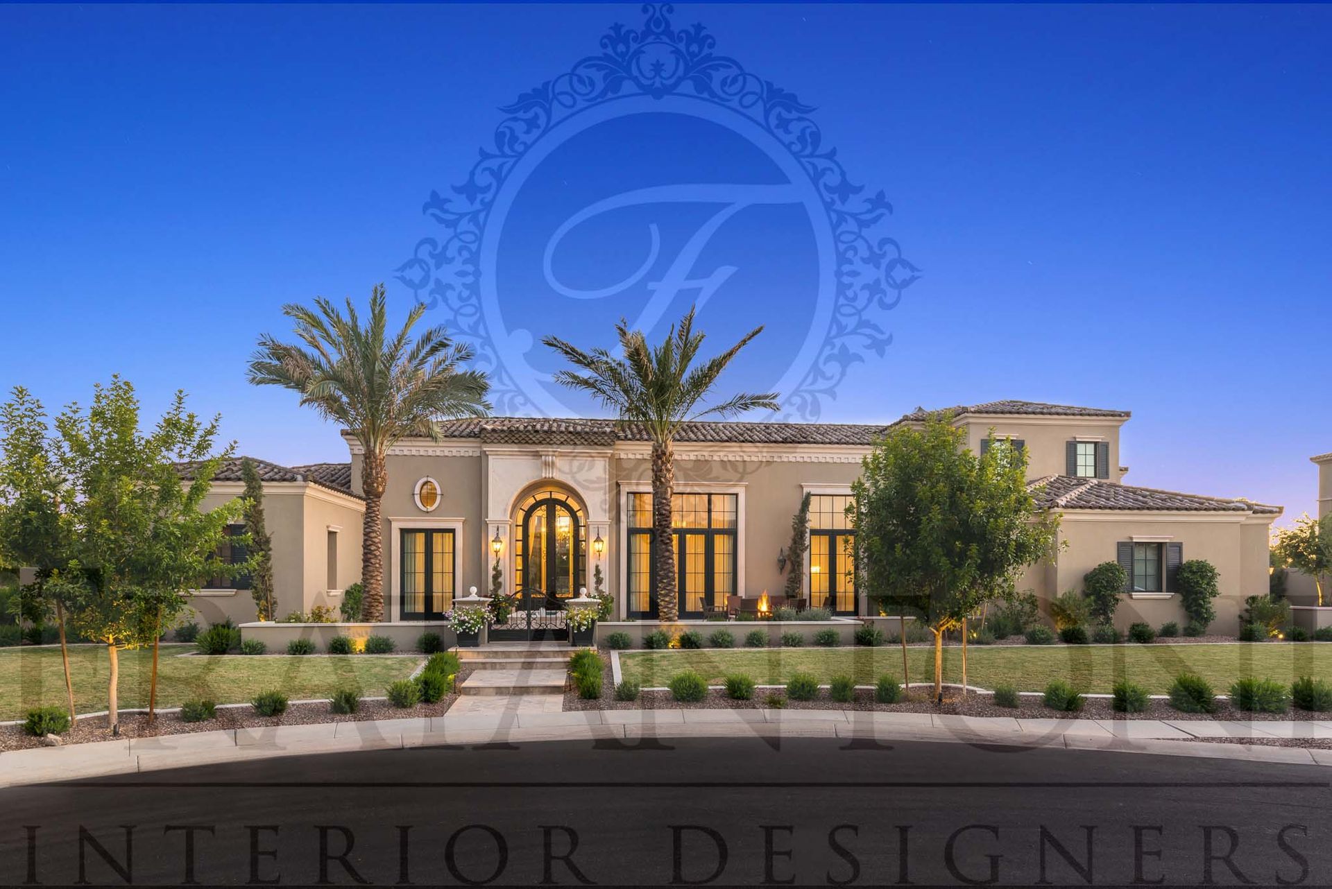 Mediterranean villa exterior with arched windows, warm lighting, and desert landscaping at dusk in Paradise Valley, Arizona