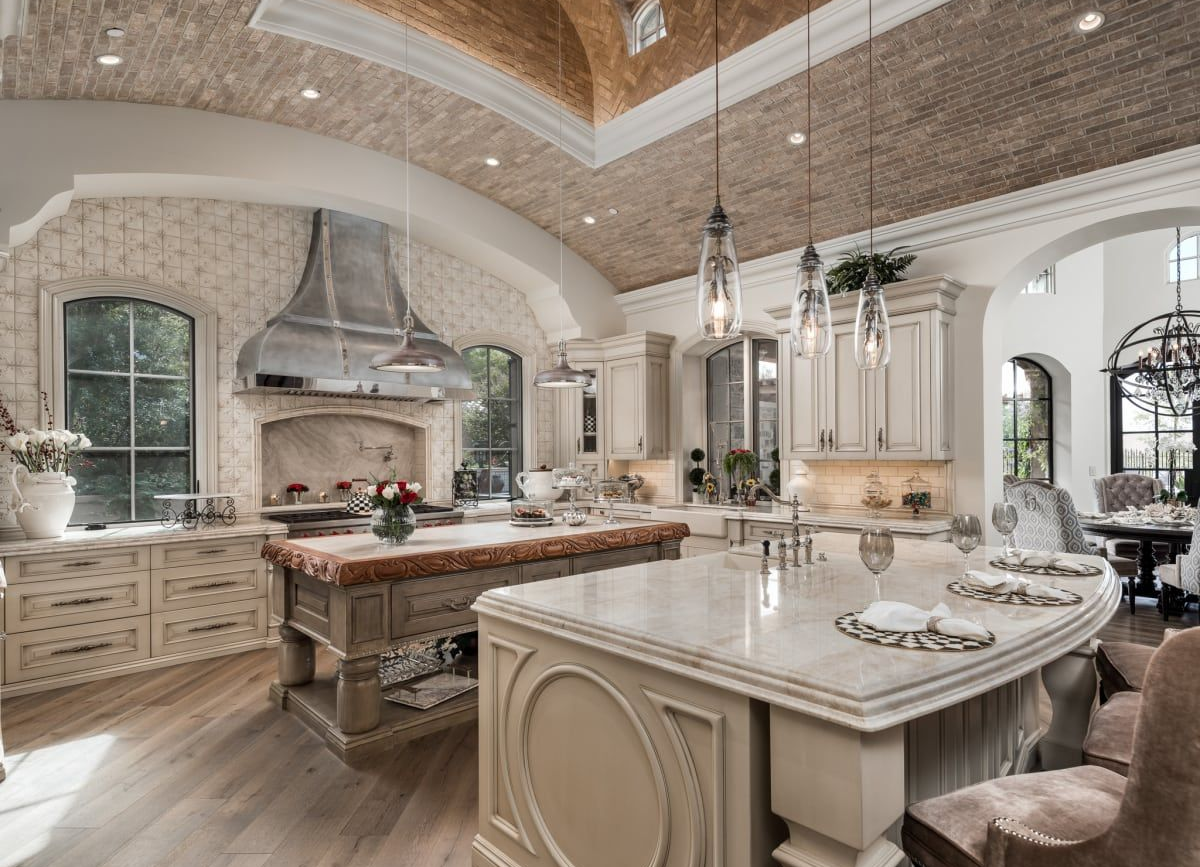 Luxury kitchen with arched brick ceiling and marble countertops